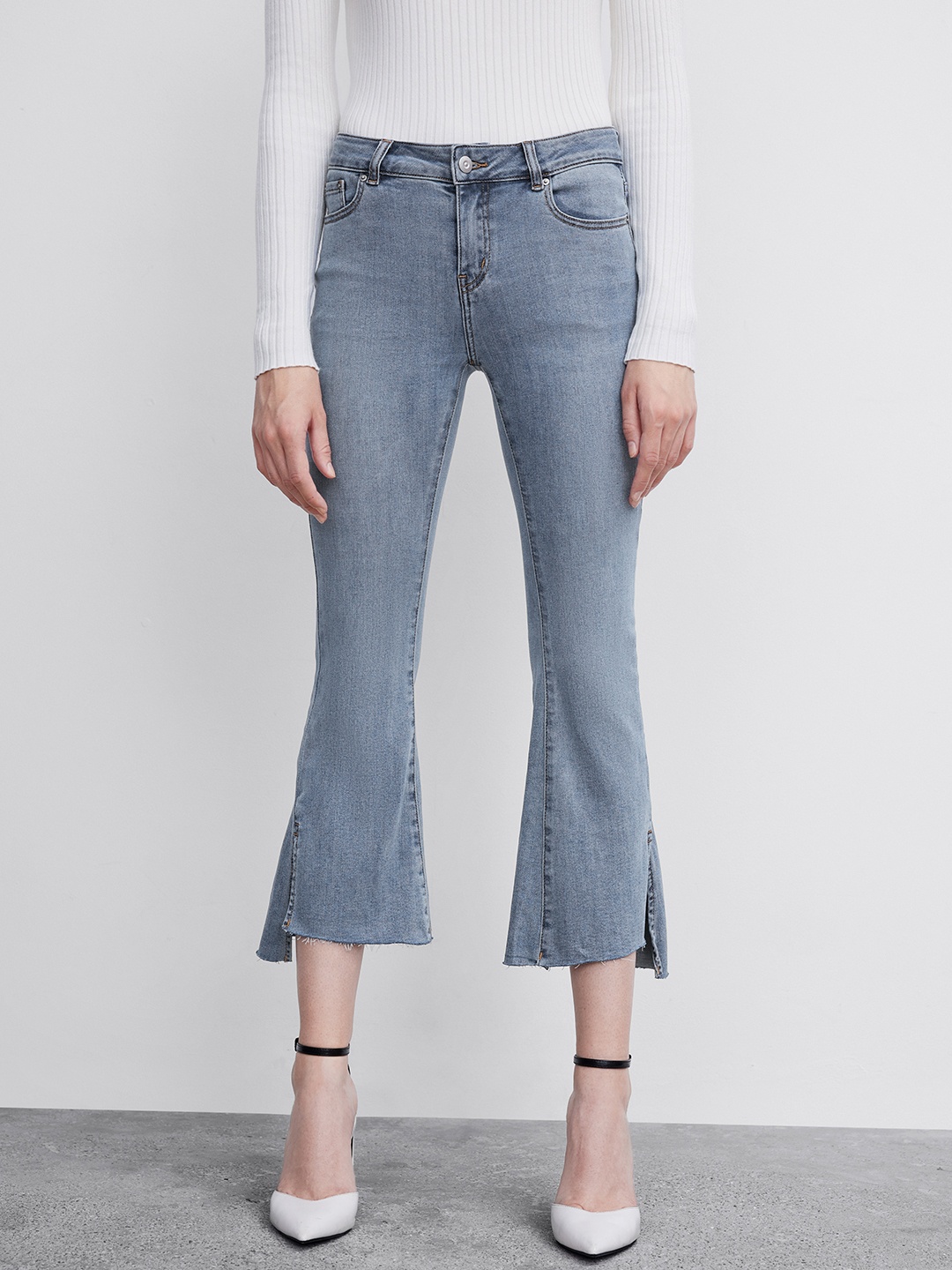 

Urban Revivo Women Slit Hem Flared High-Rise Light Fade Stretchable Jeans, Blue
