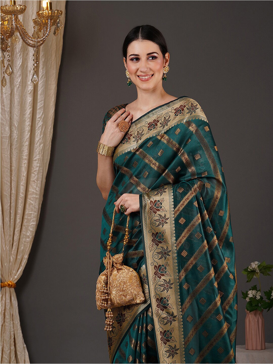 

Anouk Teal Green & Gold Toned Ethnic Motifs Woven Design Zari Organza Banarasi Saree