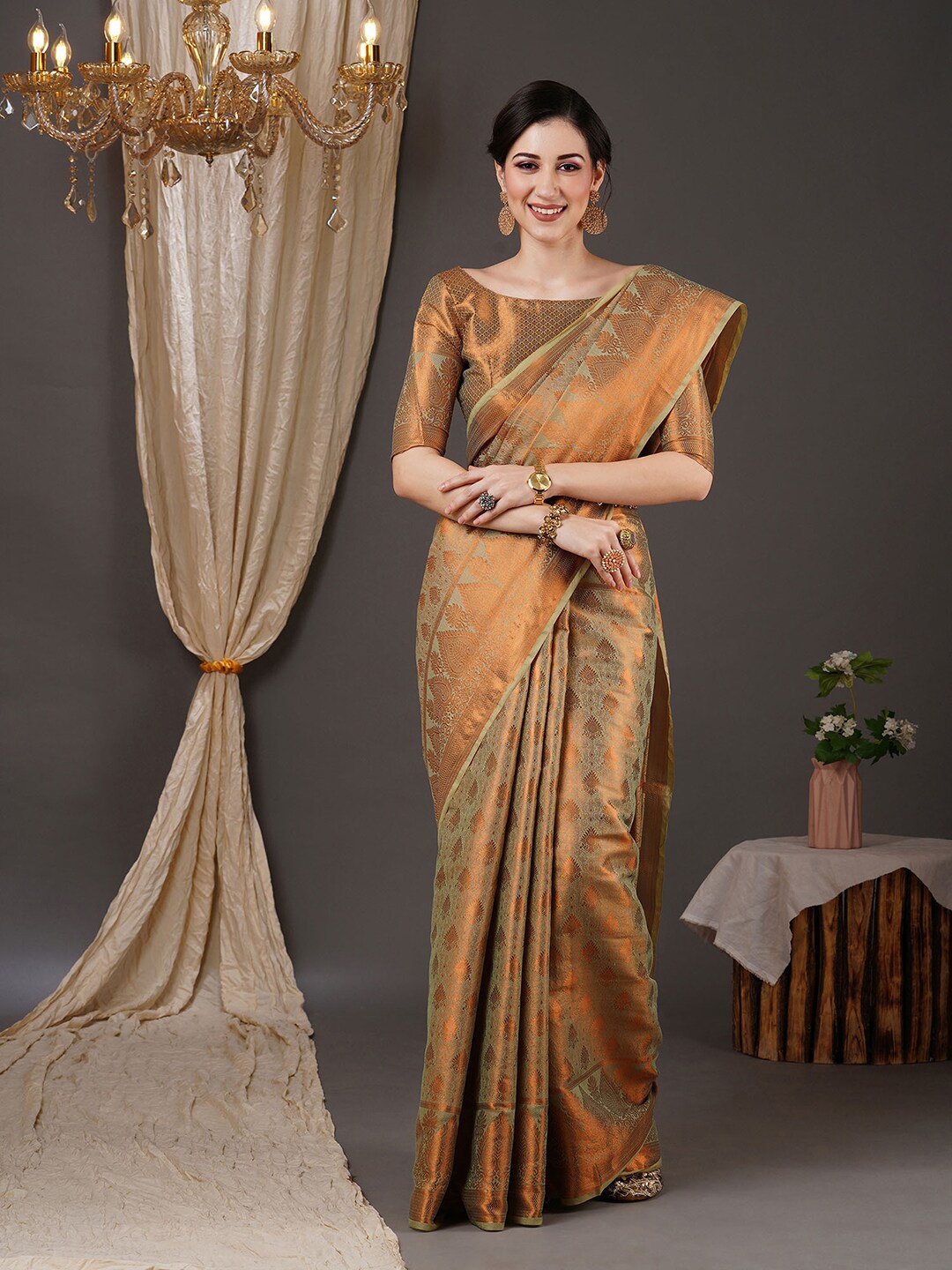 

Saree mall Green & Copper-Toned Ethnic Motif Woven Design Zari Kanjeevaram Sarees