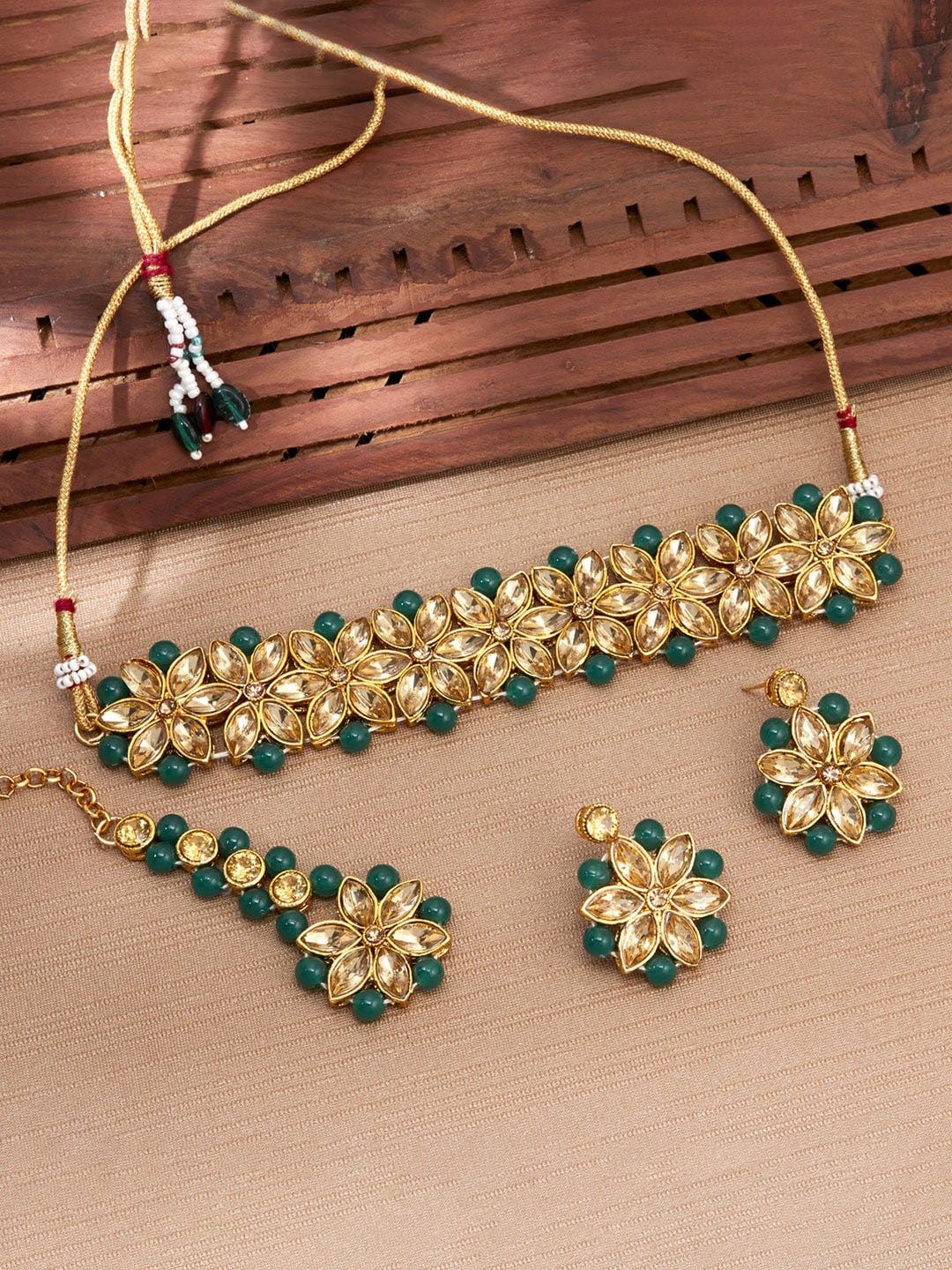 

Sukkhi Gold Plated Kundan Choker Necklace Jewellery Set