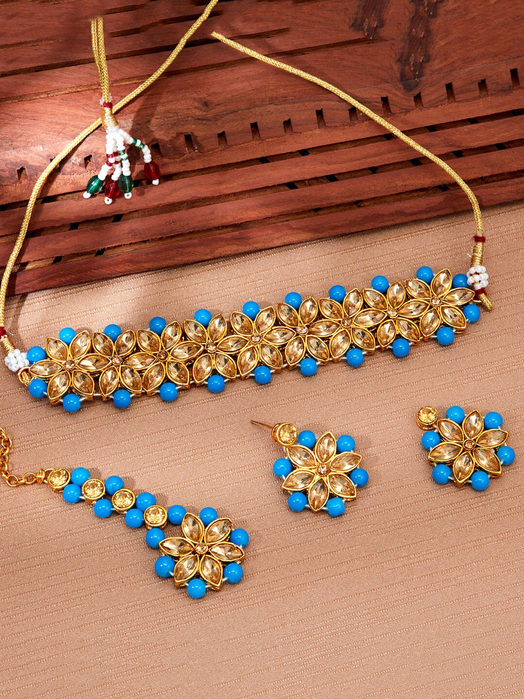 

Sukkhi Gold Plated Artificial Stones and Beads Jewellery Set