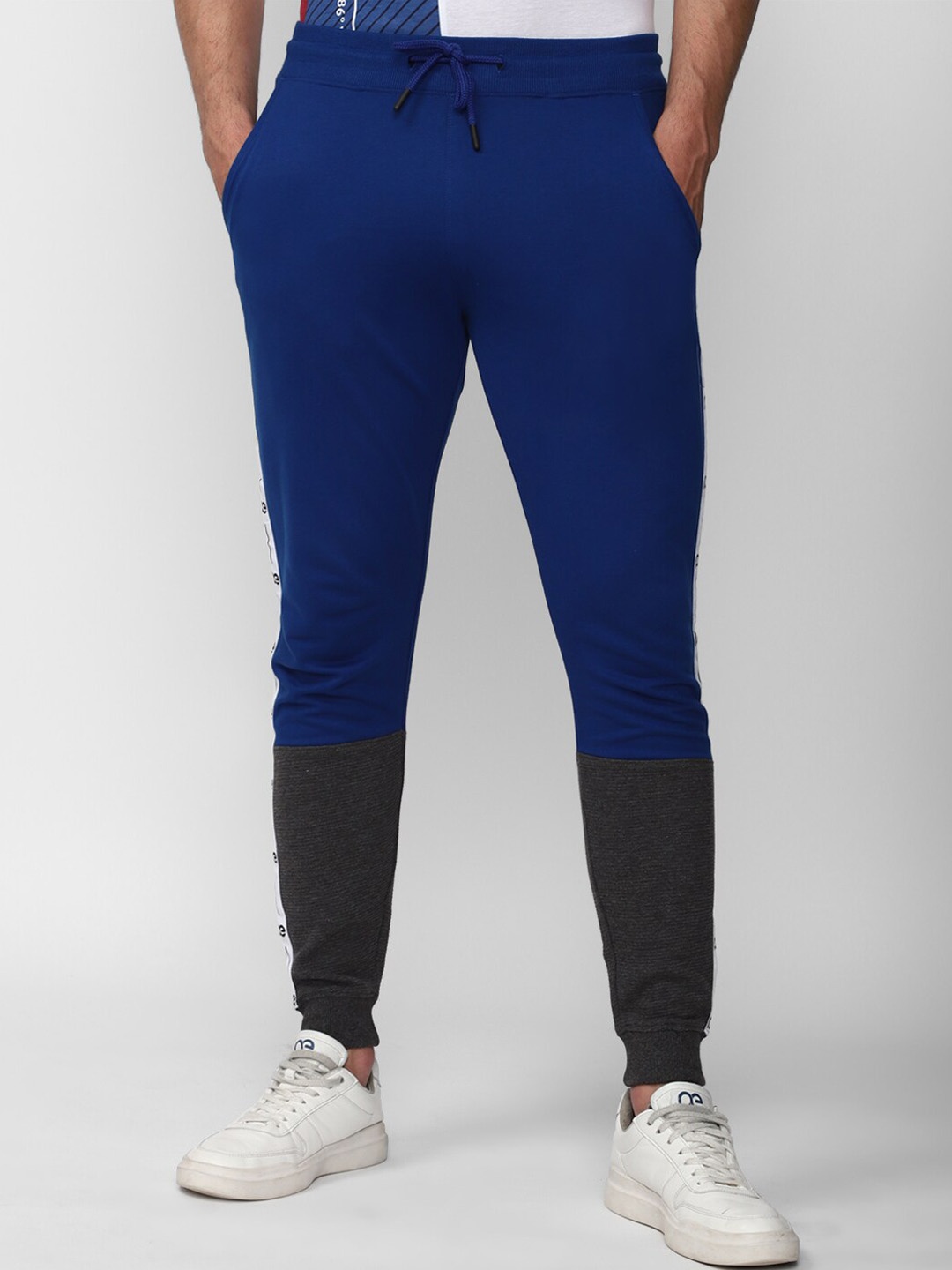 

Peter England Men Colourblocked Mid Rise Regular Fit Cotton Joggers, Blue