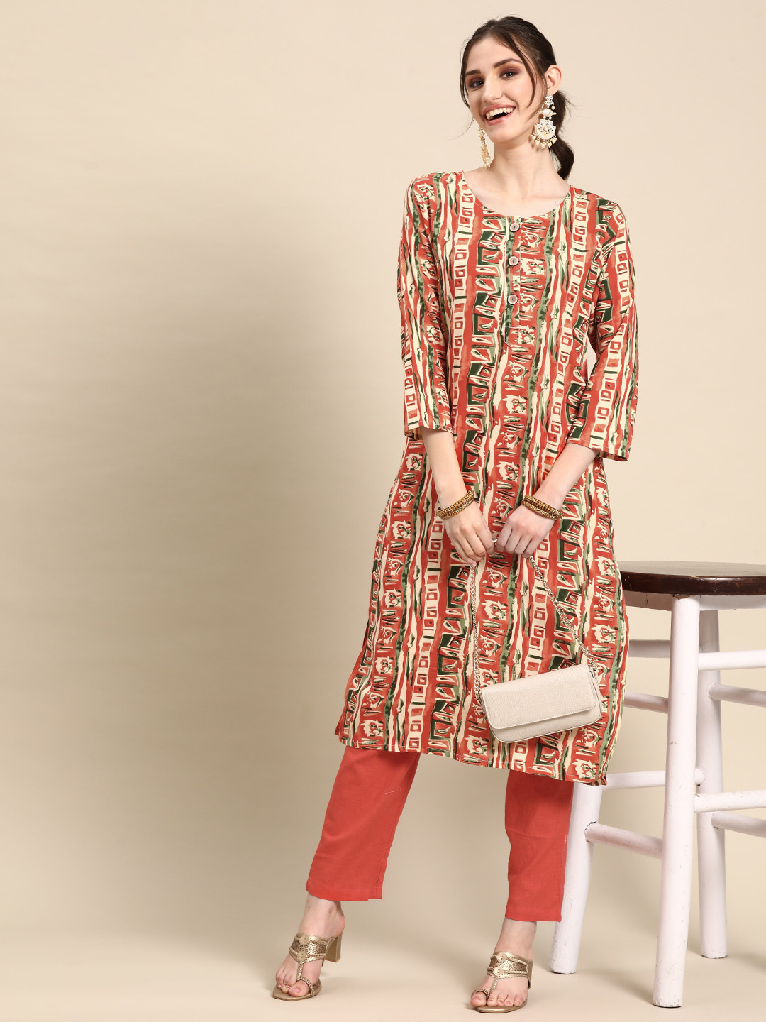 

Sangria Abstract Printed Regular Kurta With Trousers, Orange