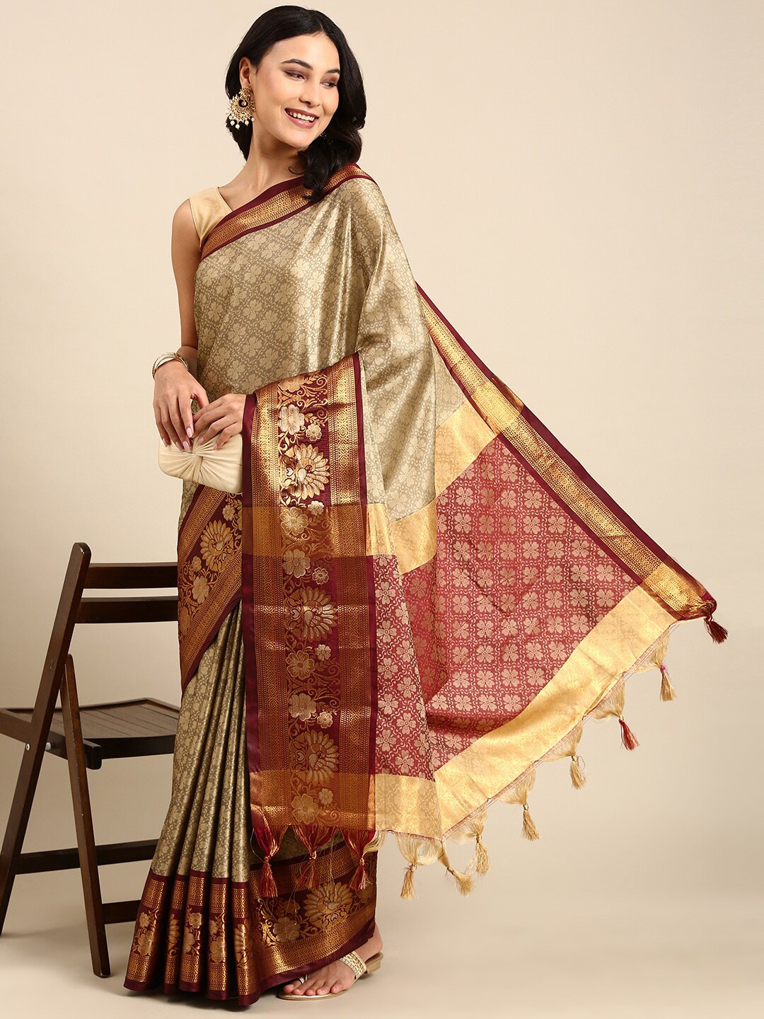 

Anouk Beige & Red Floral Woven Design Zari Kanjeevaram Saree