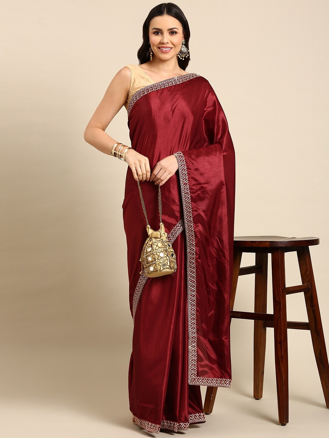 

Anouk Maroon & Gold-Toned Saree With Embelished Border