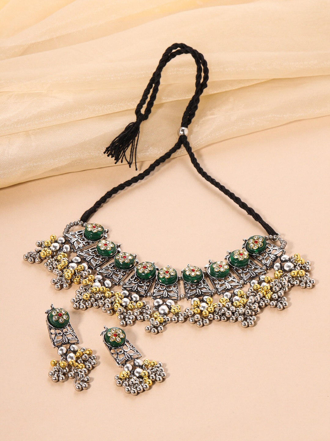 

Yellow Chimes German Silver Oxidised Ghungroo Studded Jewellery Set