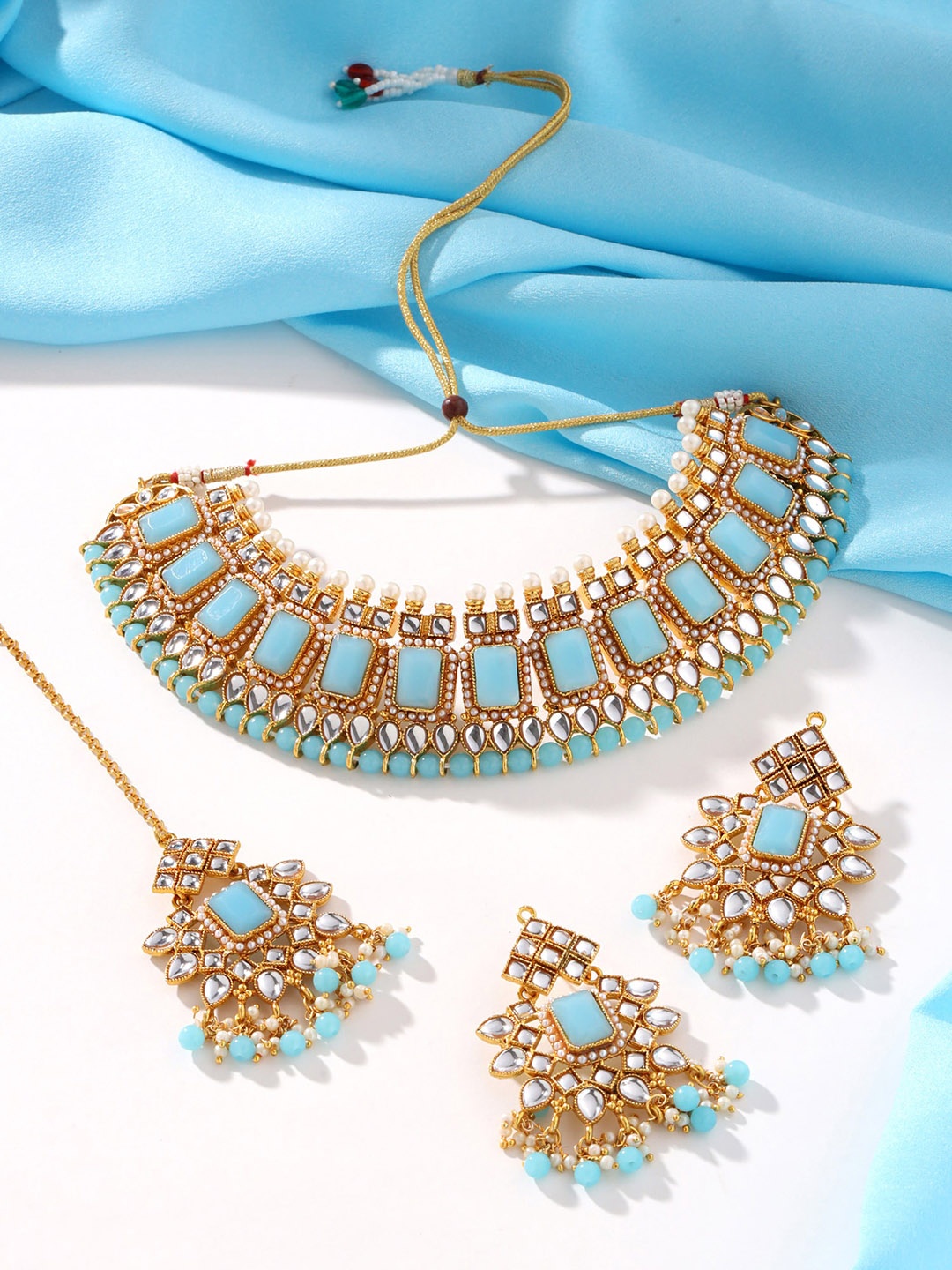 

Yellow Chimes Gold Plated Kundan Studded & Beaded Jewellery Set