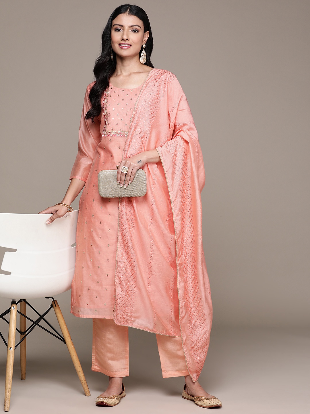 

Ishin Women Peach-Coloured Ethnic Motifs Regular Sequinned Kurta with Trousers