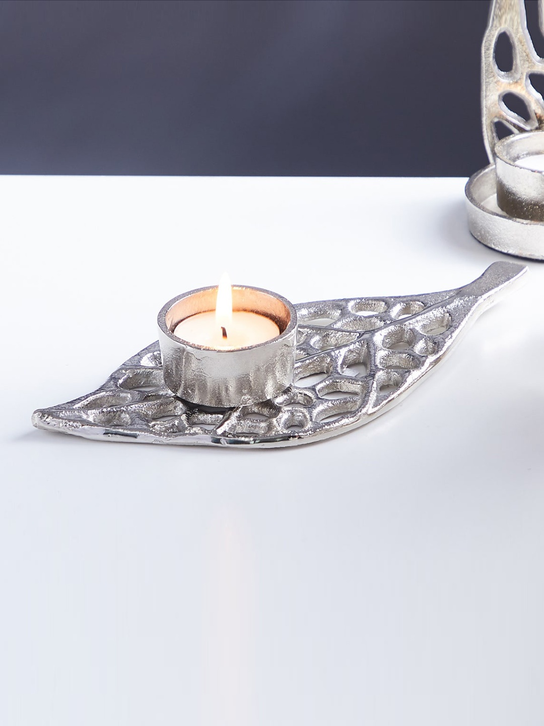 

Home Centre Silver-Toned Textured Metal Floor T-Light Holder