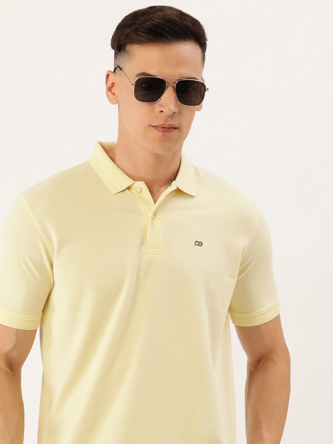 

Peter England Men Solid Polo Collar Slim Fit T-shirt, Cream