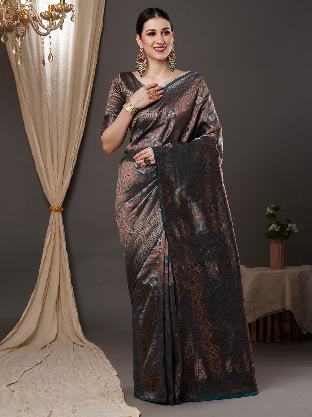 

Saree mall Teal Blue & Copper-Toned Ethnic Motif Woven Design Zari Kanjeevaram Sarees