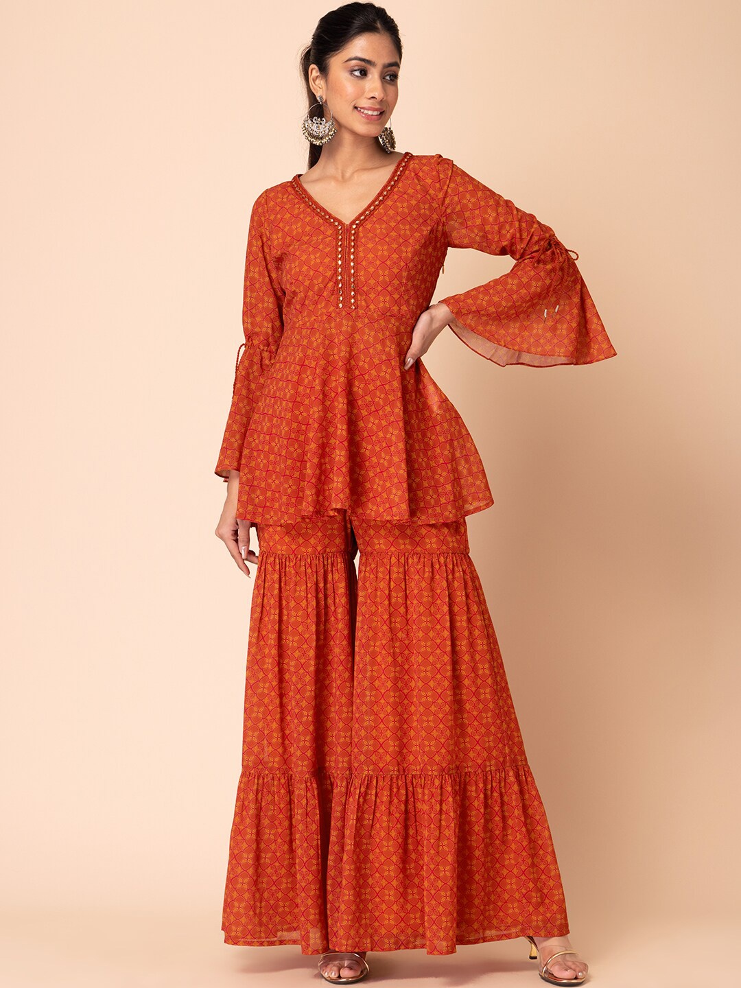 

INDYA Ethnic Motifs Printed Thread Work Georgette Kurti With Sharara, Mustard