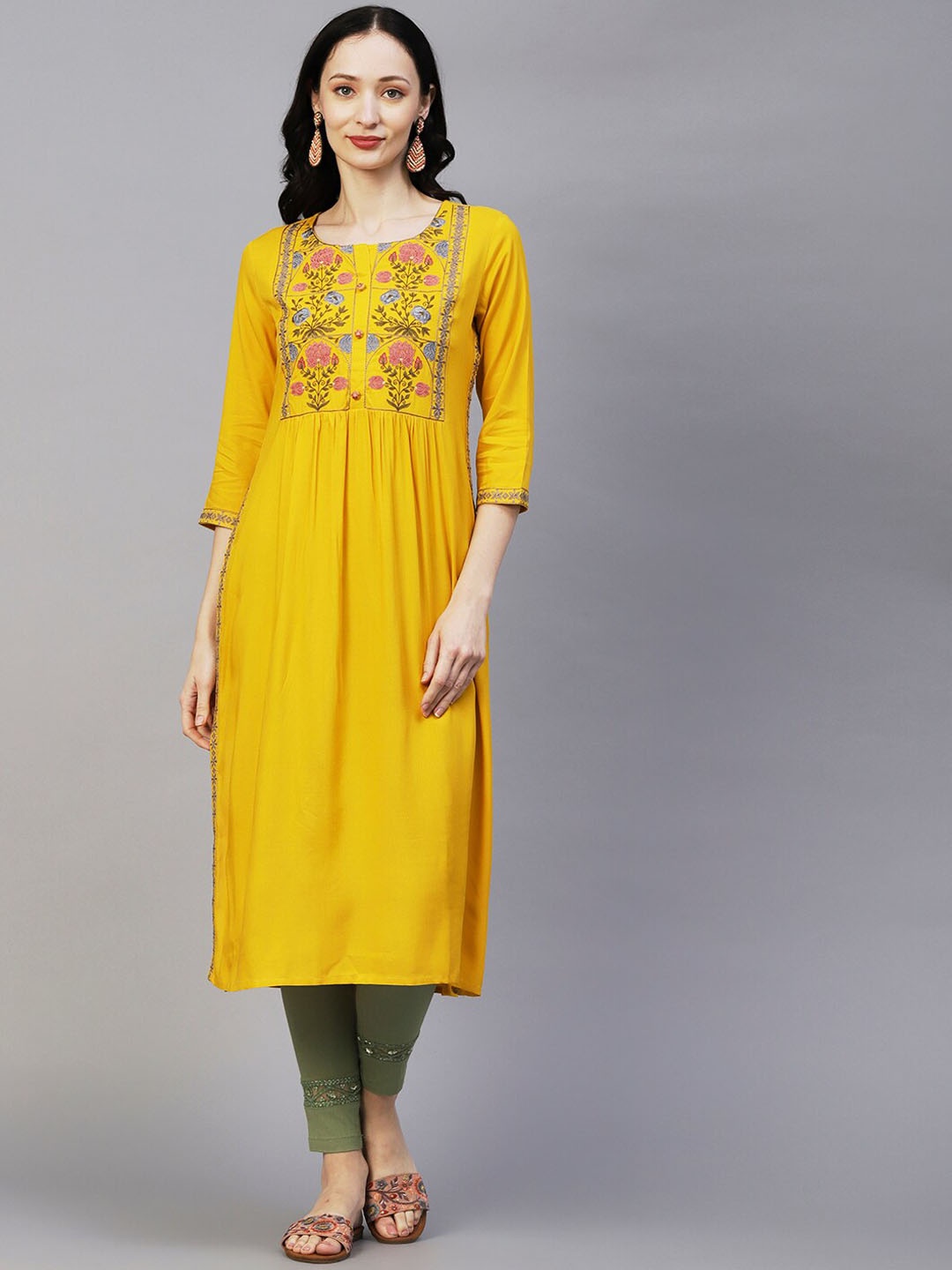 

FASHOR Women Yellow Floral Yoke Design Thread Work A-Line Kurta, Mustard