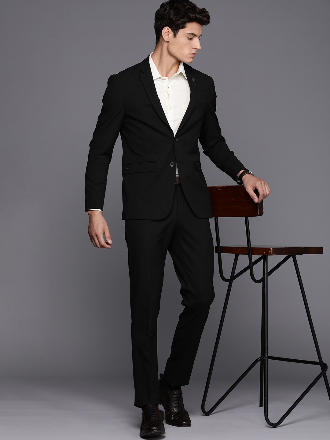 

Peter England Elite Men Solid Two Piece Suit, Black