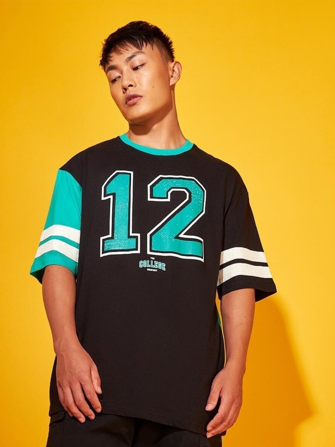 

Bewakoof Plus Men Black Varsity Printed Applique Loose T-shirt