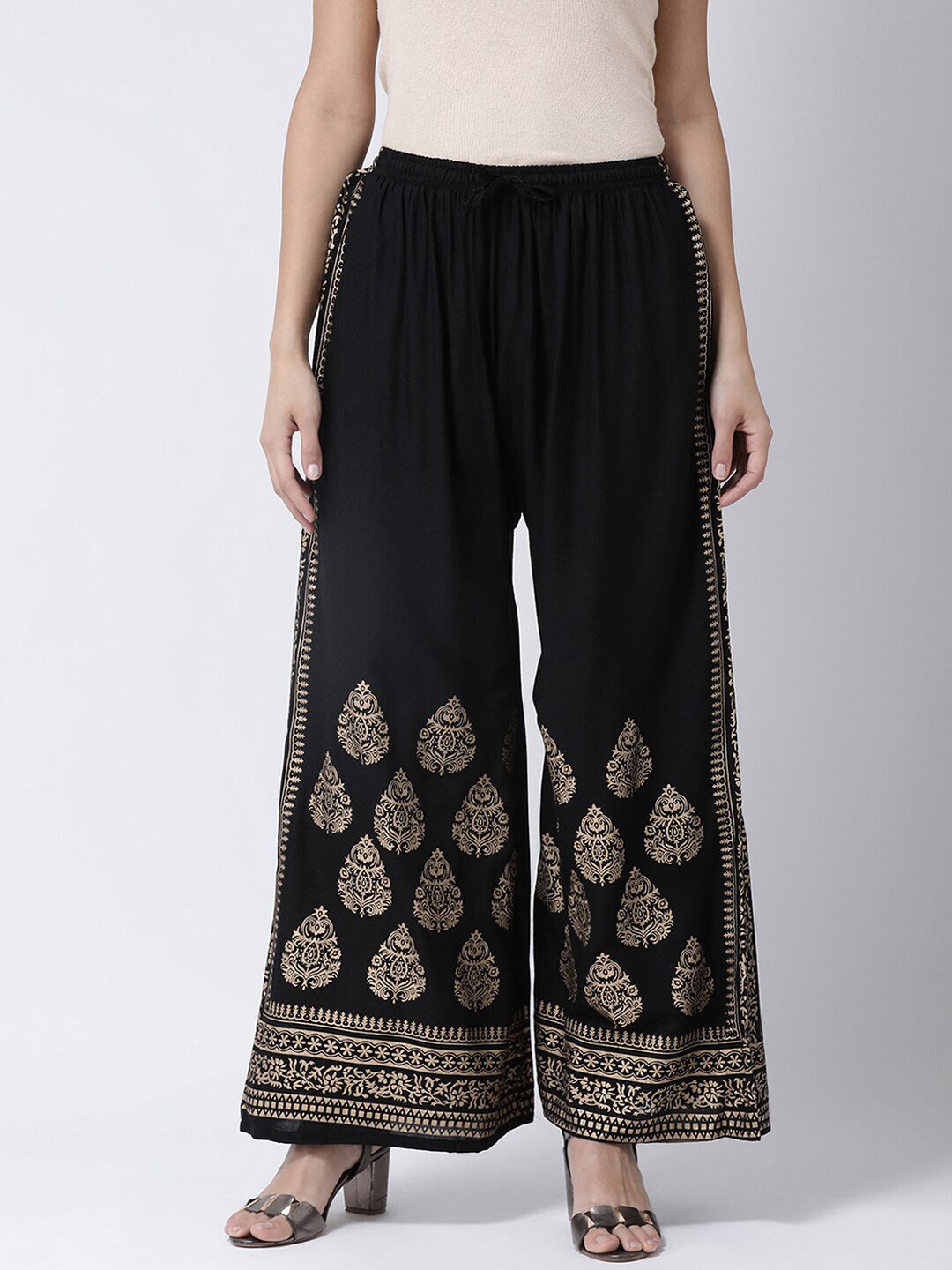 

Charitra Women Ethnic Motifs Printed Flared Cotton Palazzos, Black