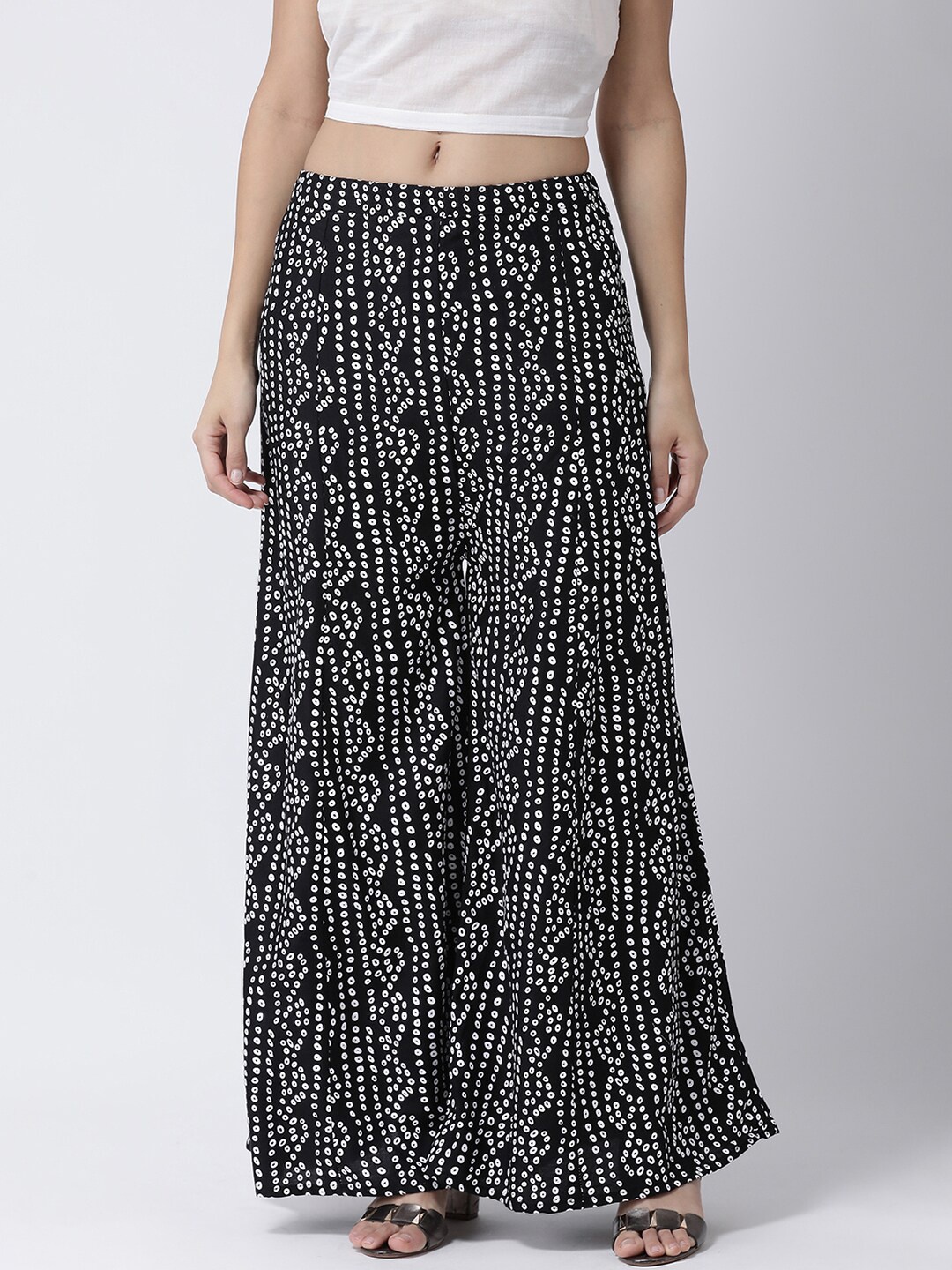 

Charitra Women Ethnic Motifs Printed Flared Cotton Palazzos, Black