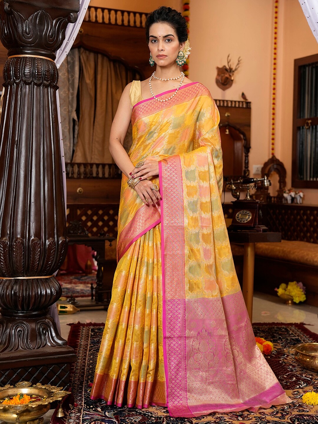 

Satrani Yellow & Pink Ethnic Motifs Woven Design Zari Banarasi Saree