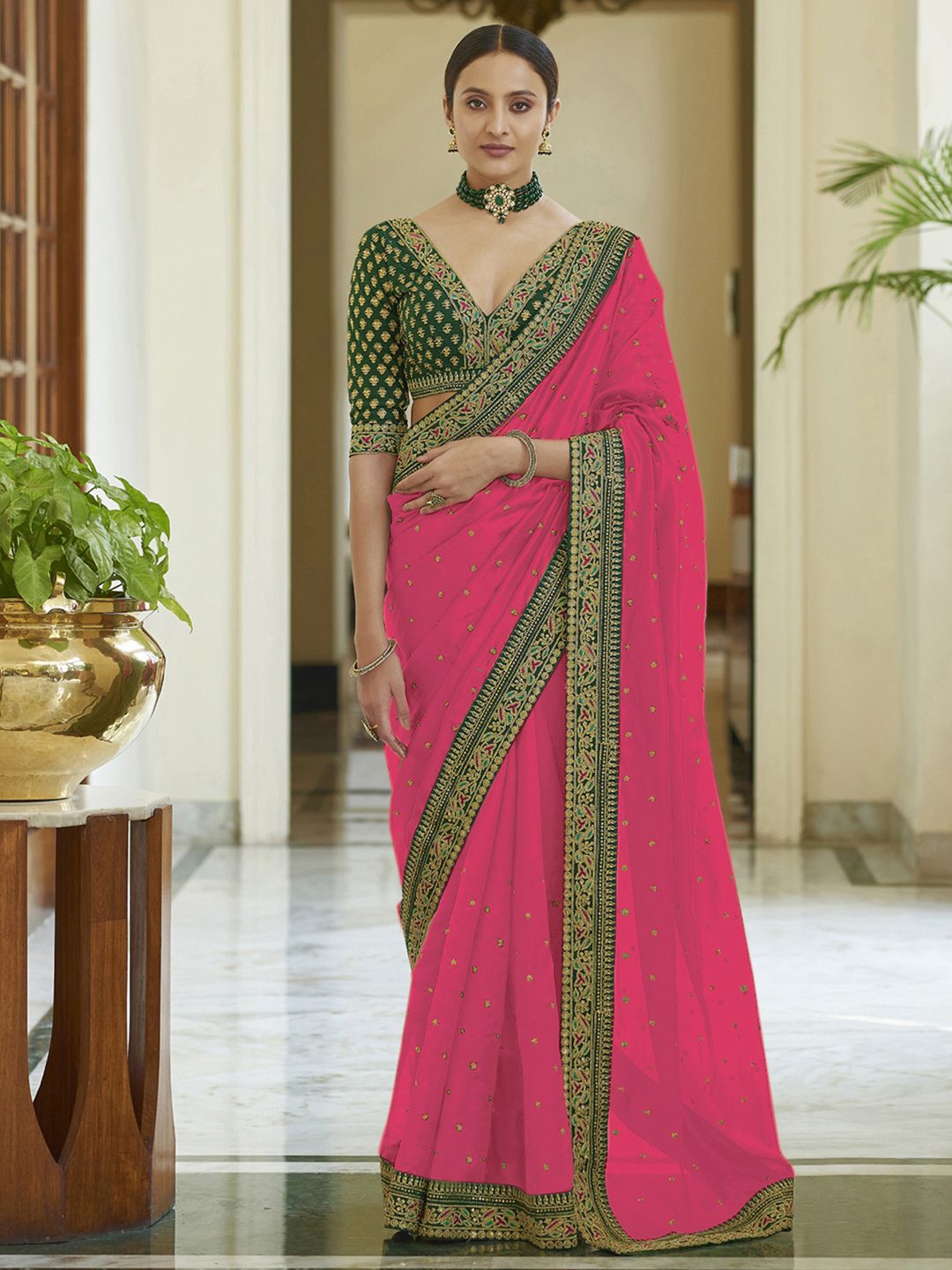 

Satrani Pink & Green Ethnic Motifs Embroidered Saree