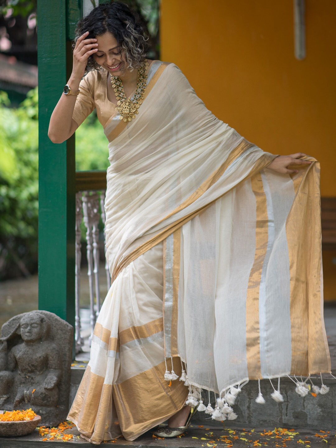 

Suta White & Gold-Toned Zari Detailed Saree