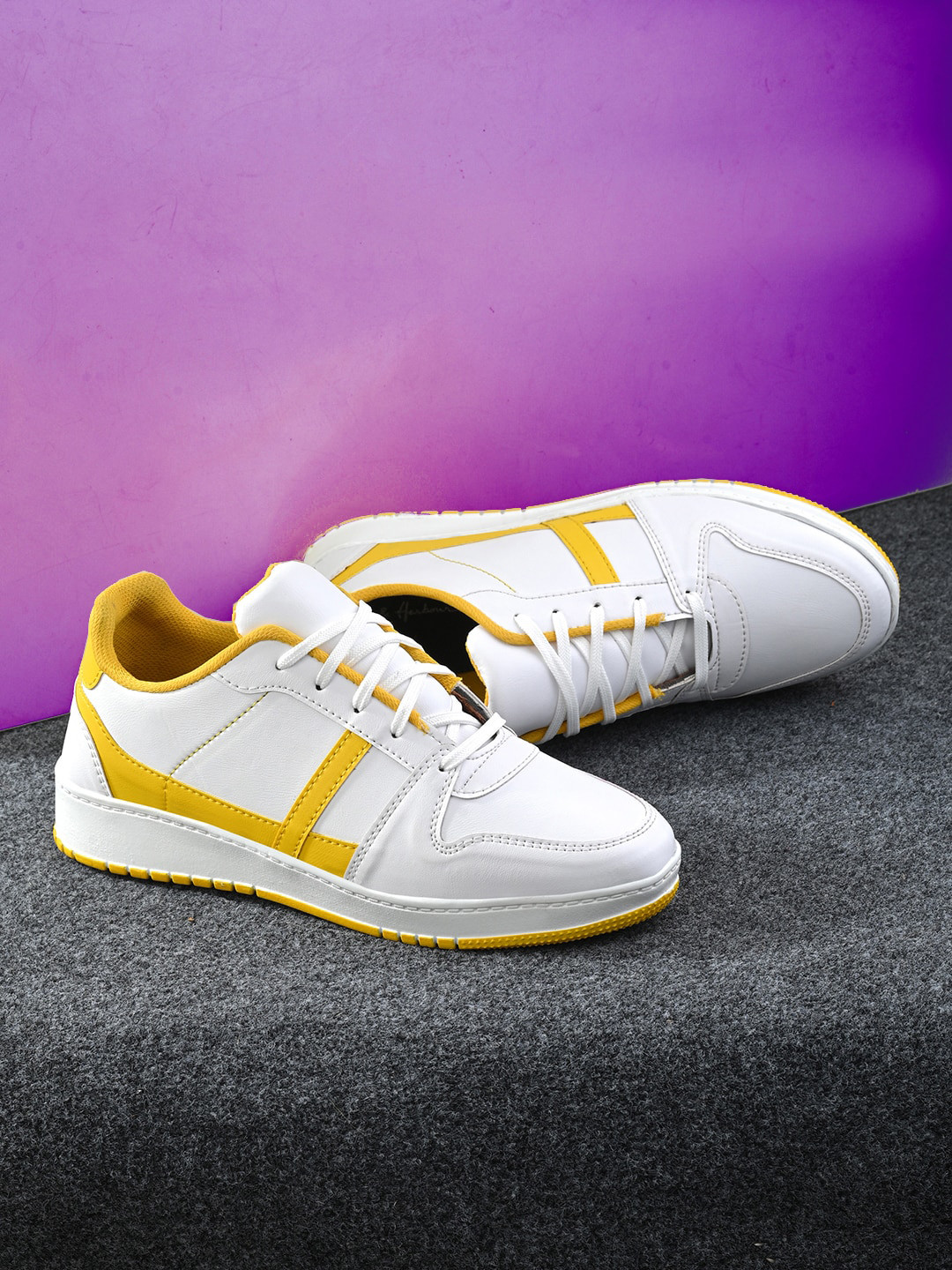 

The Roadster Lifestyle Co. Men White And Yellow Colourblocked Sneakers