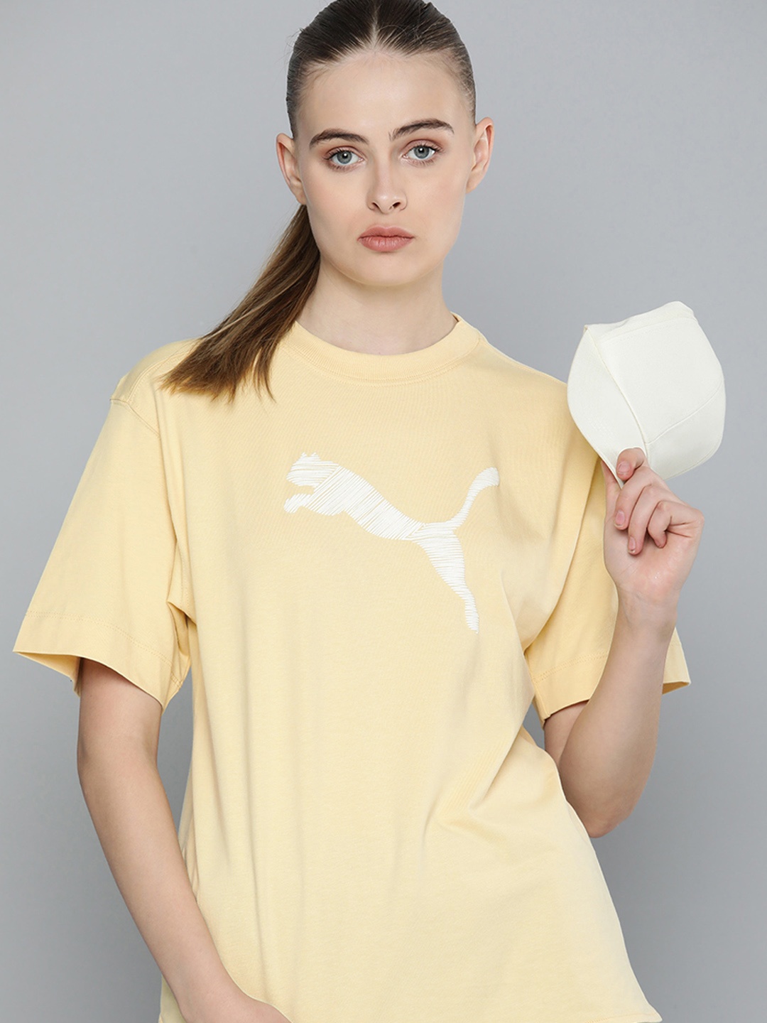 

Puma HER Brand Logo Printed Relaxed Fit Drop-Shoulder Sleeves Pure Cotton Sustainable T-shirt, Yellow