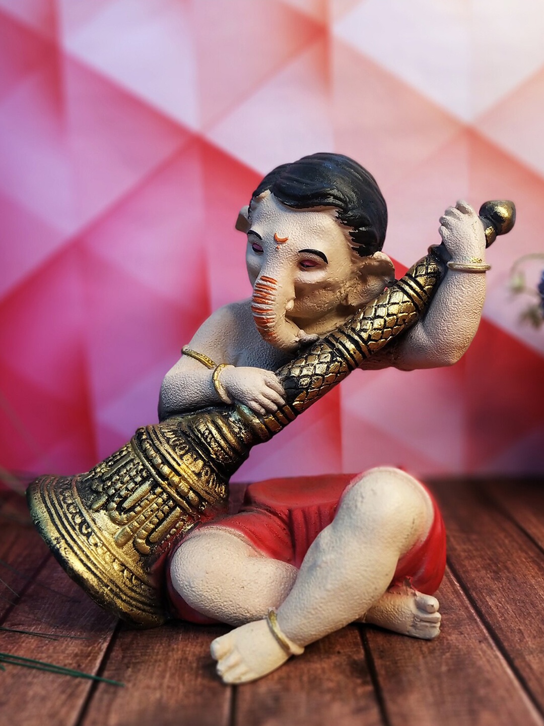 

WENS Red & Cream-Colored Textured Ganesha Idol Showpiece