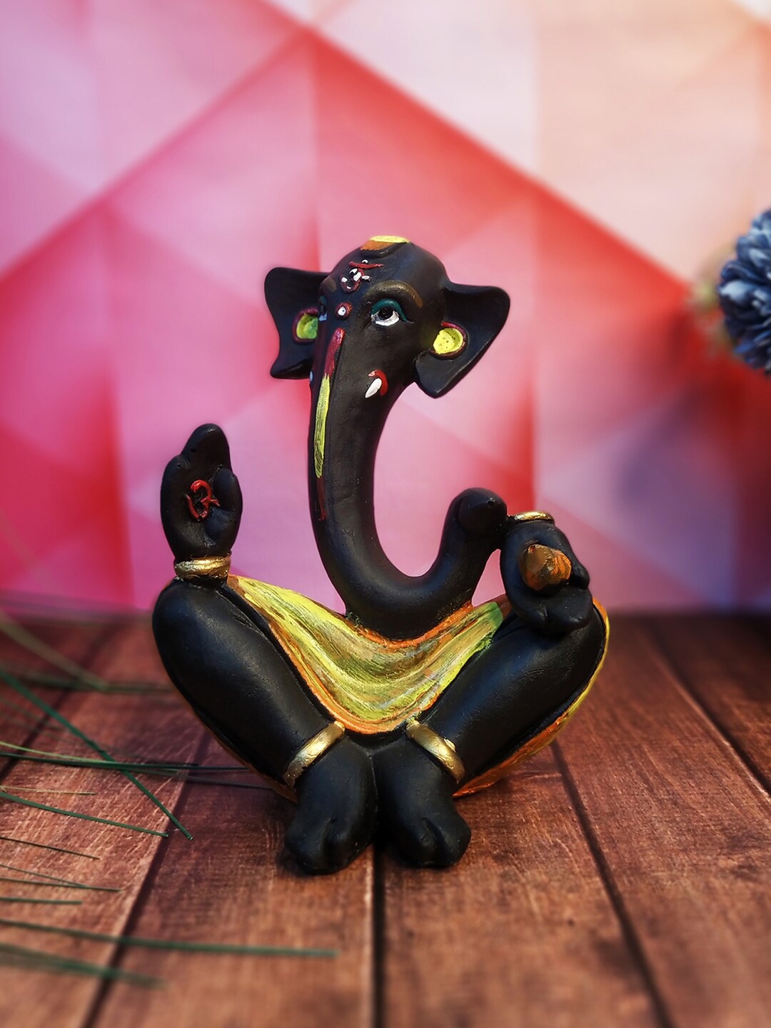 

WENS Black & Yellow Textured Polyresin Ganesha Statue Idol Showpiece