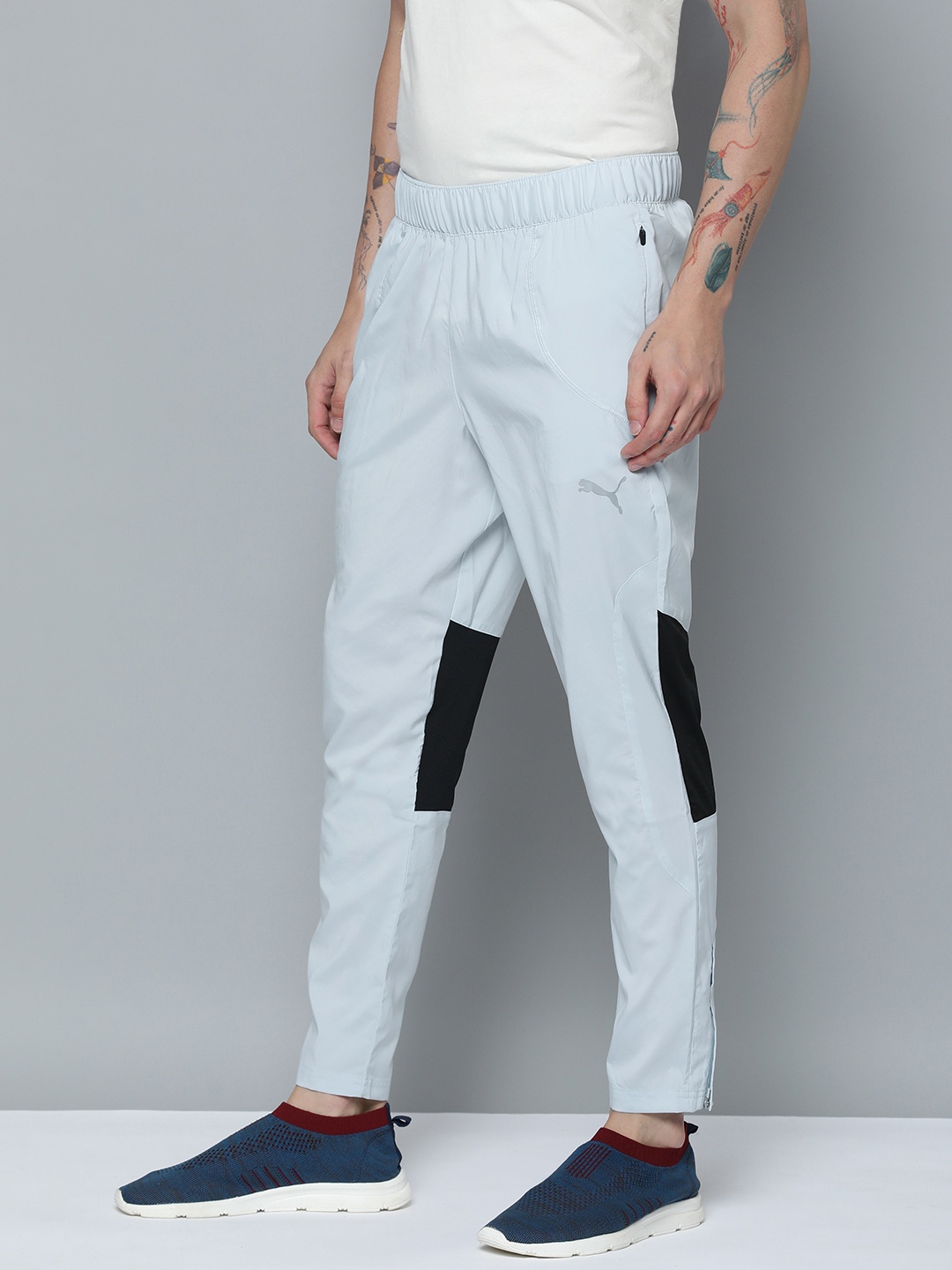 

Puma Men Tapered Fit Woven Colourblocked Mid-Rise dryCELL Sustainable Running Trackpants, Grey
