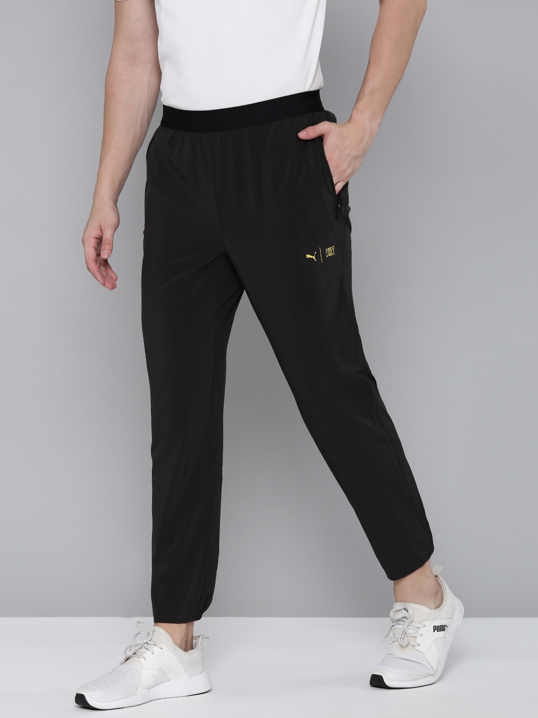 

PUMA x First Mile Men Tailored Fit Drycell Solid Mid Rise Running Joggers, Black