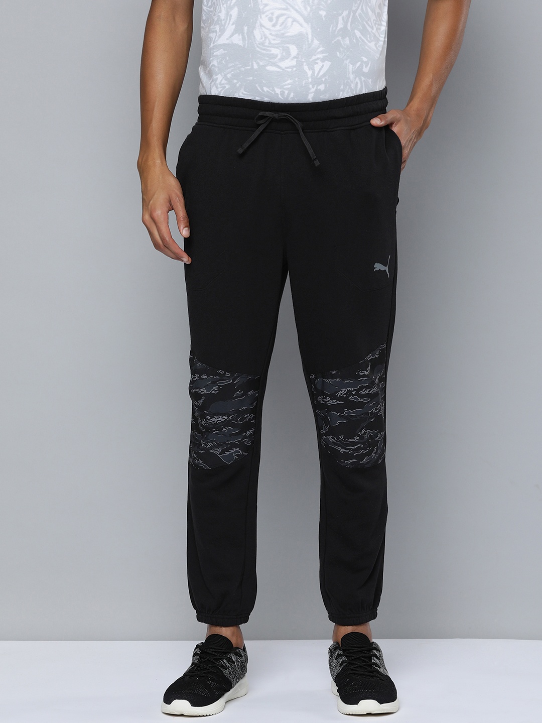 

Puma Men Abstract Print Regular Fit Mid-Rise Train Concept Knitted Training Or Gym Joggers, Black