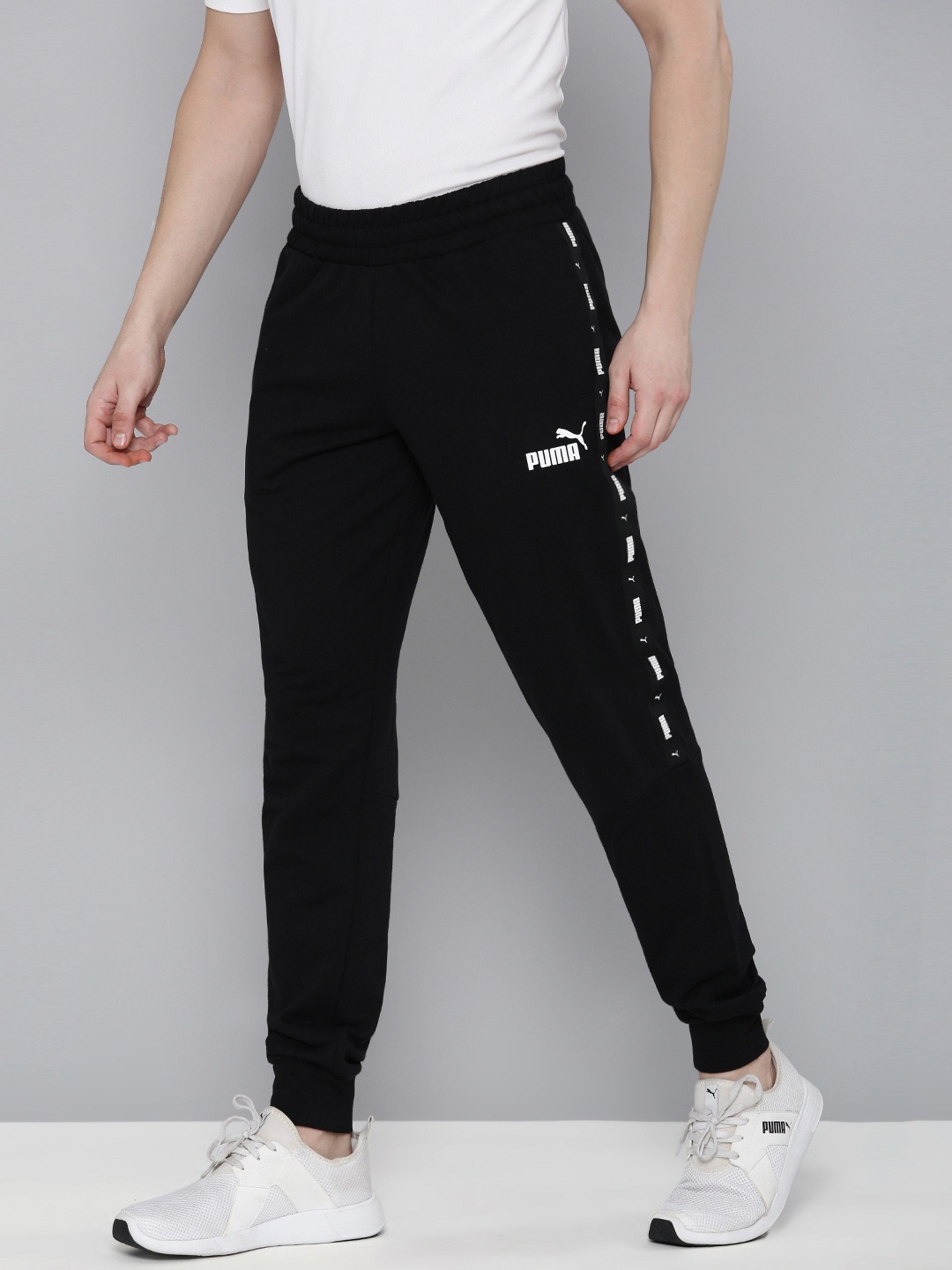 

Puma ESS Tape Men Regular Fit Solid Joggers, Black
