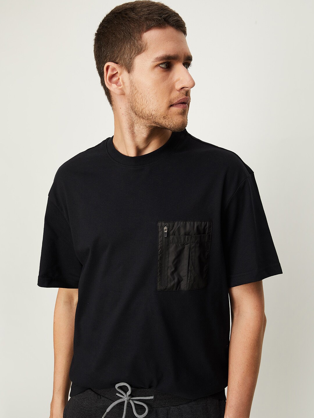 

max Men Black Typography Round Neck Pockets Oversized T-shirt