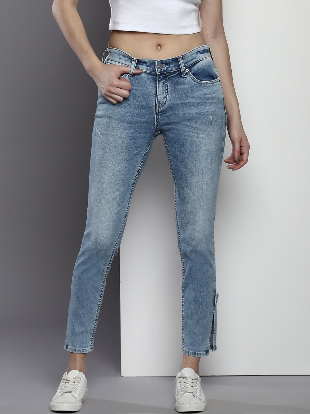 

Calvin Klein Jeans Women Skinny Fit Light Fade Slit Stretchable Jeans, Blue