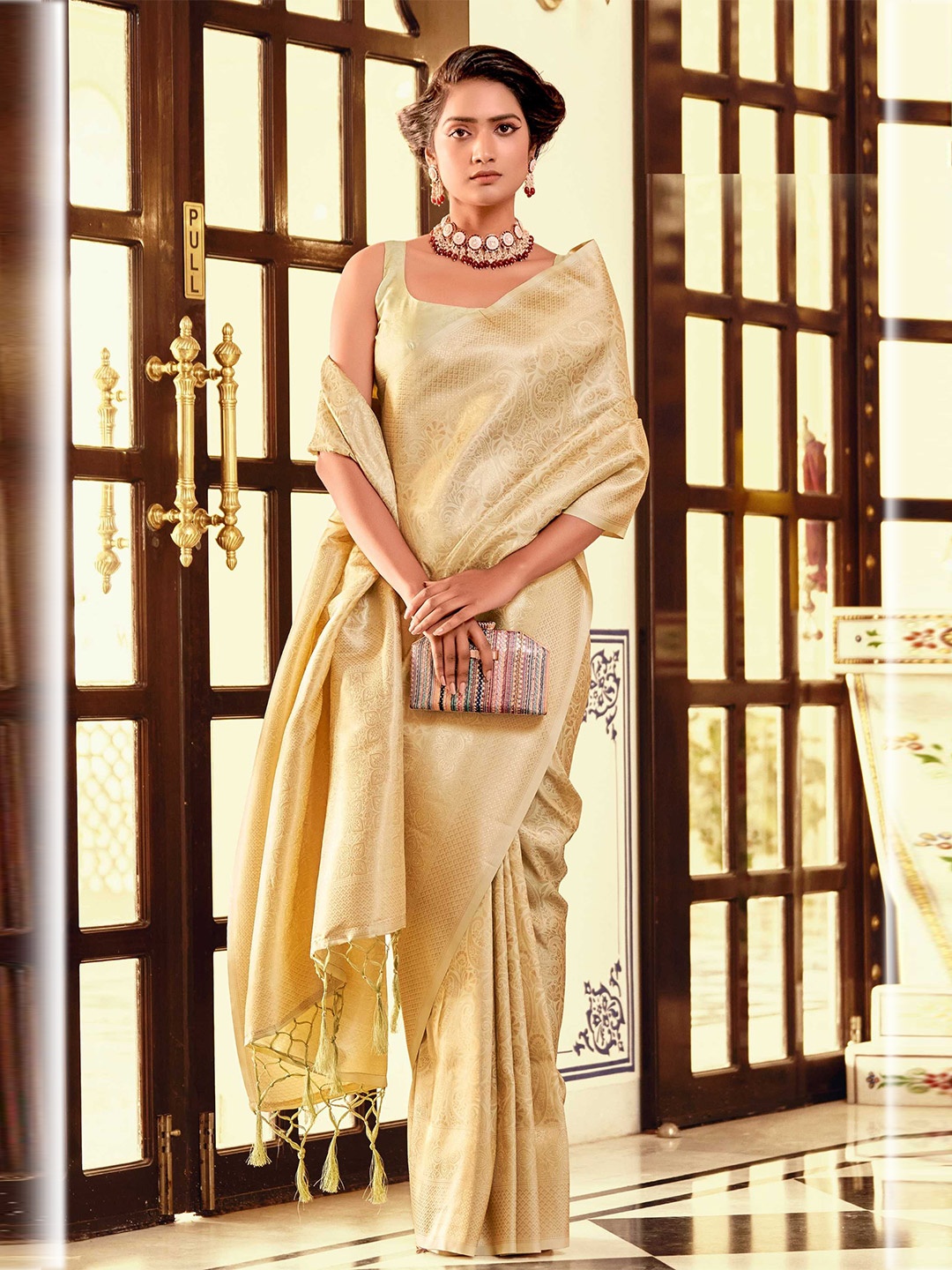 

Mitera Yellow & Gold-Toned Paisley Woven Design Zari Kanjeevaram Saree