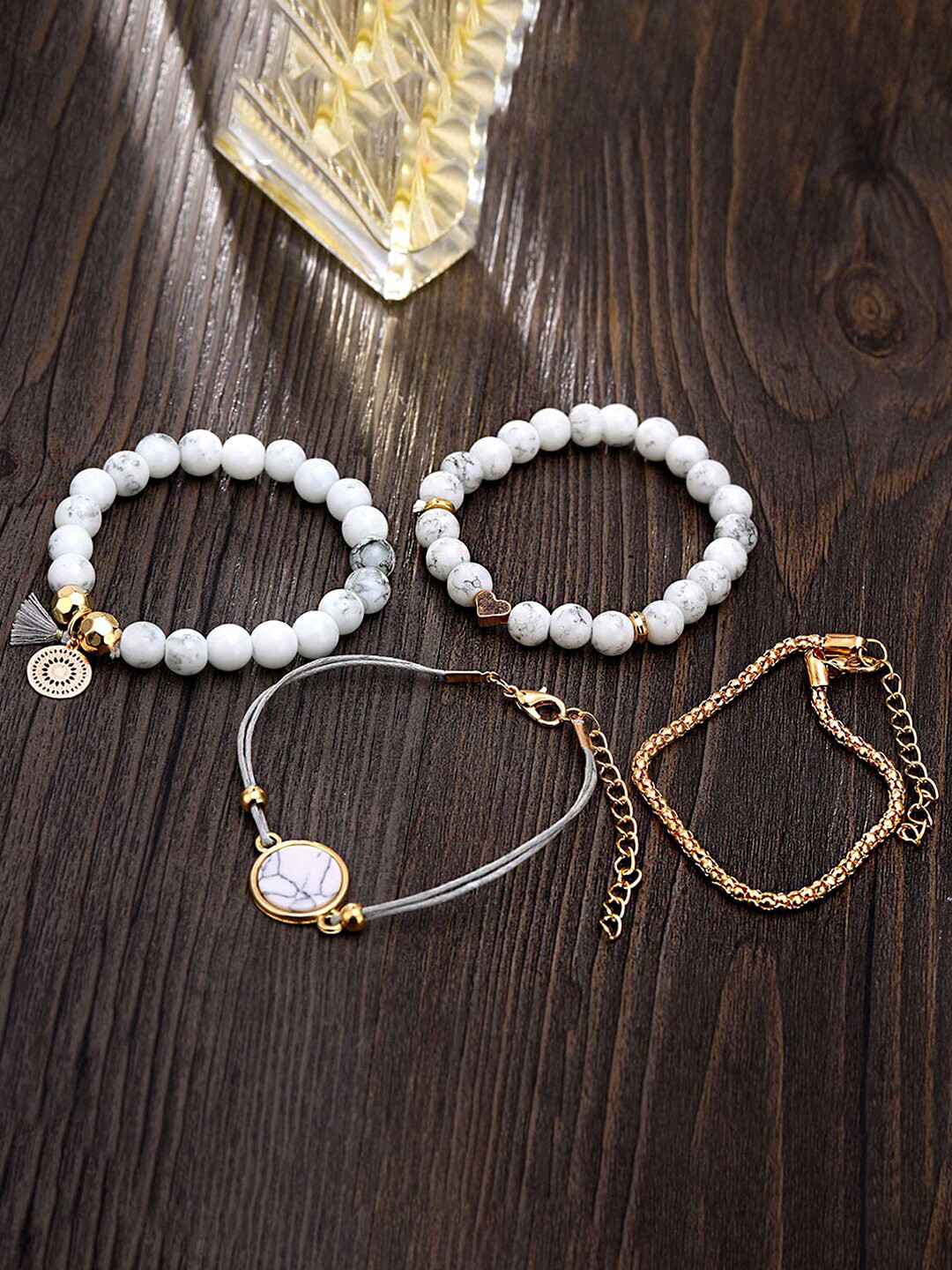 

Yellow Chimes Women Set Of 4 Gold-Plated Beaded Charm Bracelet