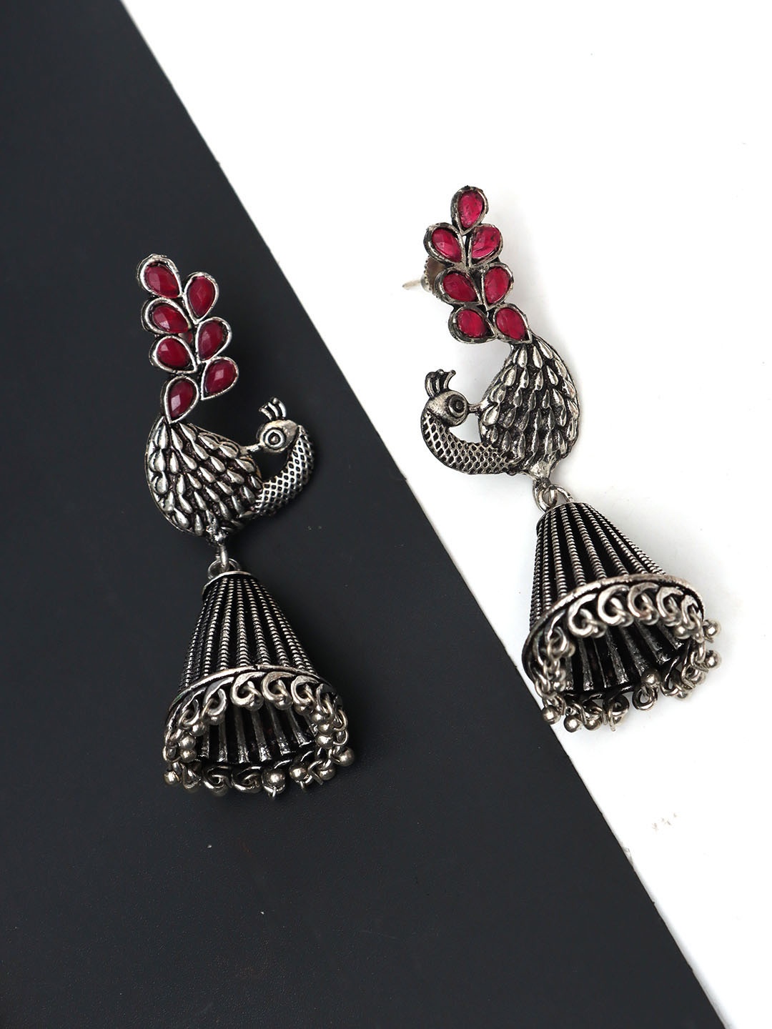 

Ozanoo Silver-Plated Oxidised Peacock Shaped Floral Jhumkas