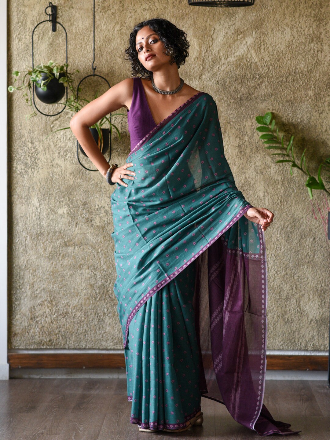 

Suta Teal & Purple Floral Printed Pure Cotton Saree