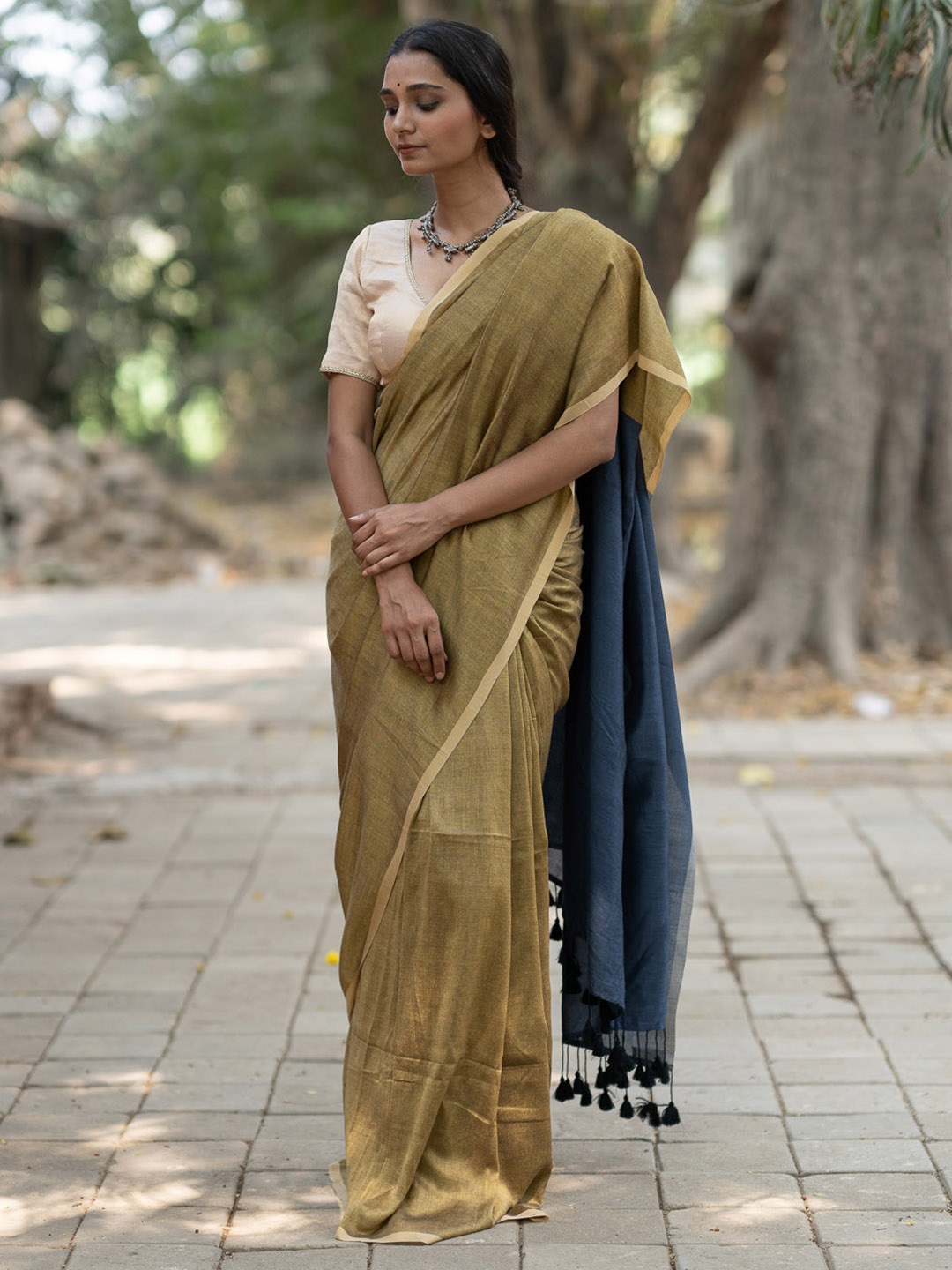 

Suta Olive Green & Blue Saree With Tassels