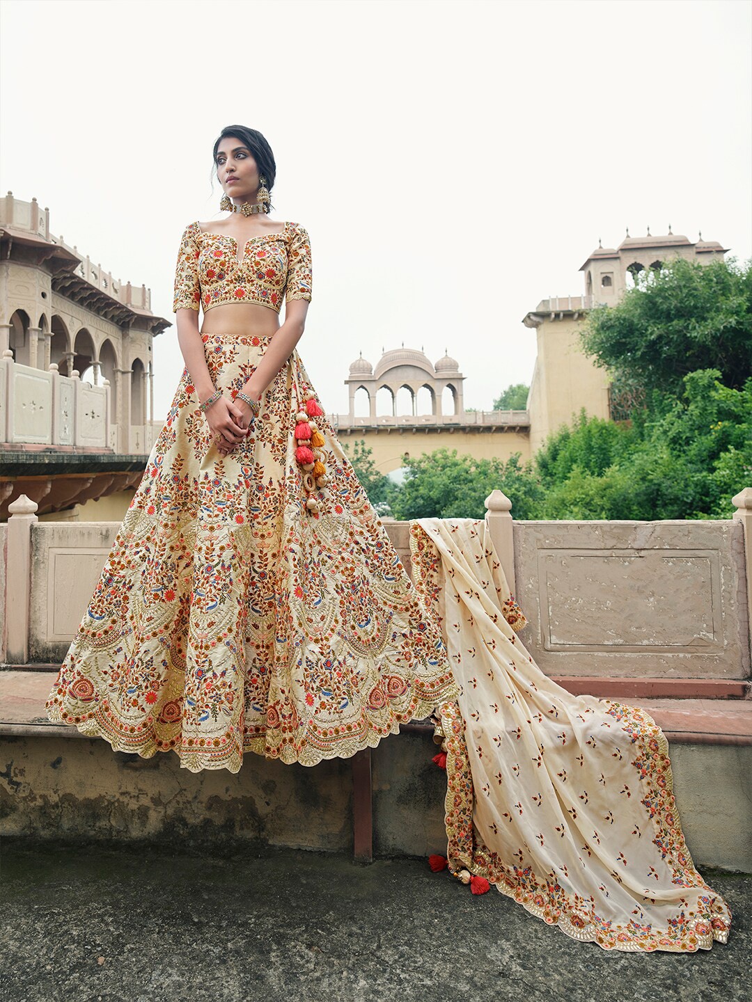 

Inddus Cream-Coloured & Red Embroidered Thread Work Semi-Stitched Lehenga & Unstitched Blouse With Dupatta