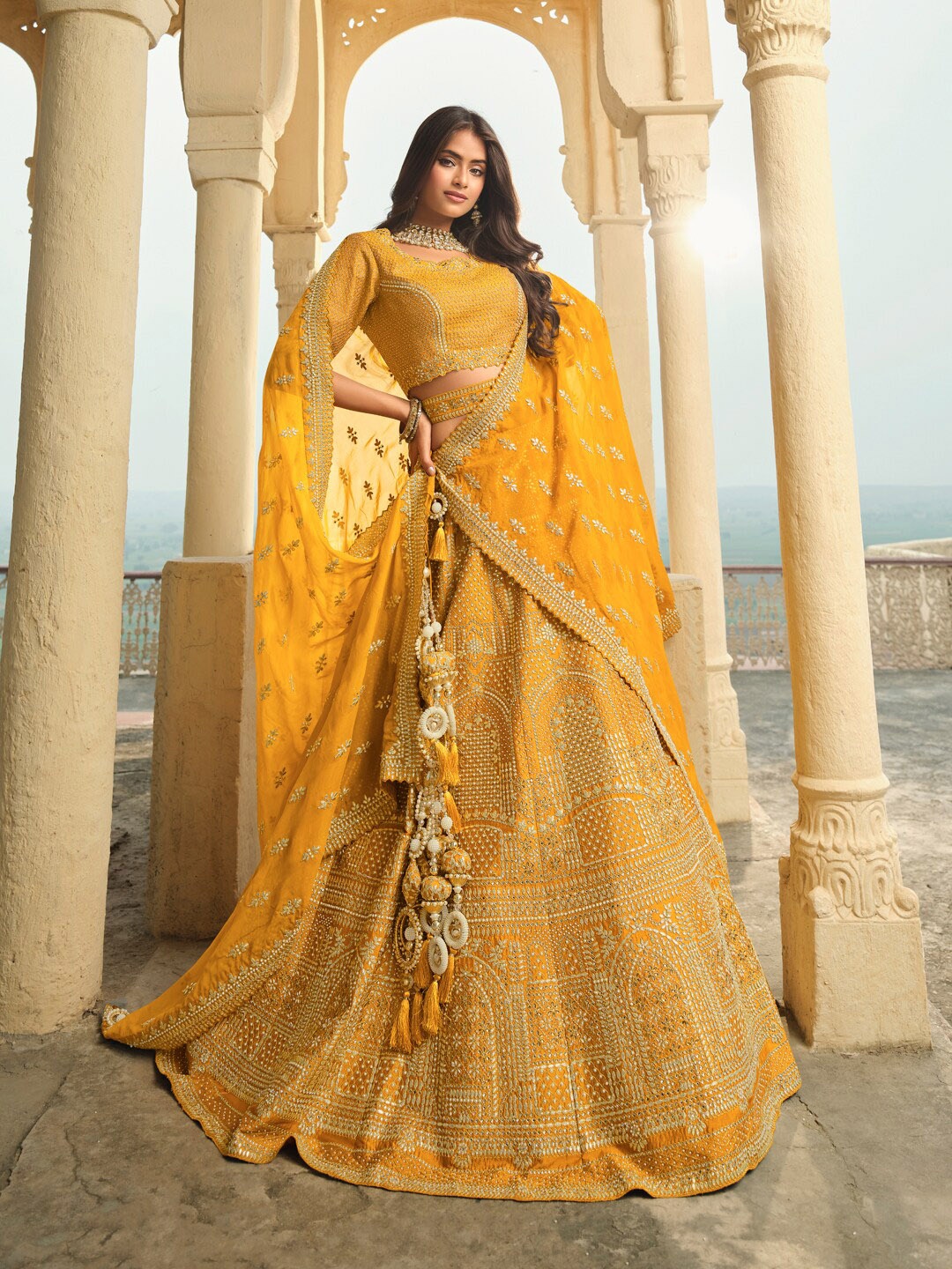 

Inddus Mustard Yellow Embroidered Semi-Stitched Lehenga & Unstitched Blouse With Dupatta