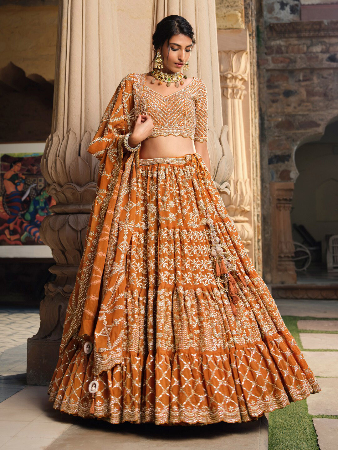 

Inddus Rust & Gold-Toned Embroidered Beads and Stones Semi-Stitched Lehenga & Unstitched Blouse With Dupatta
