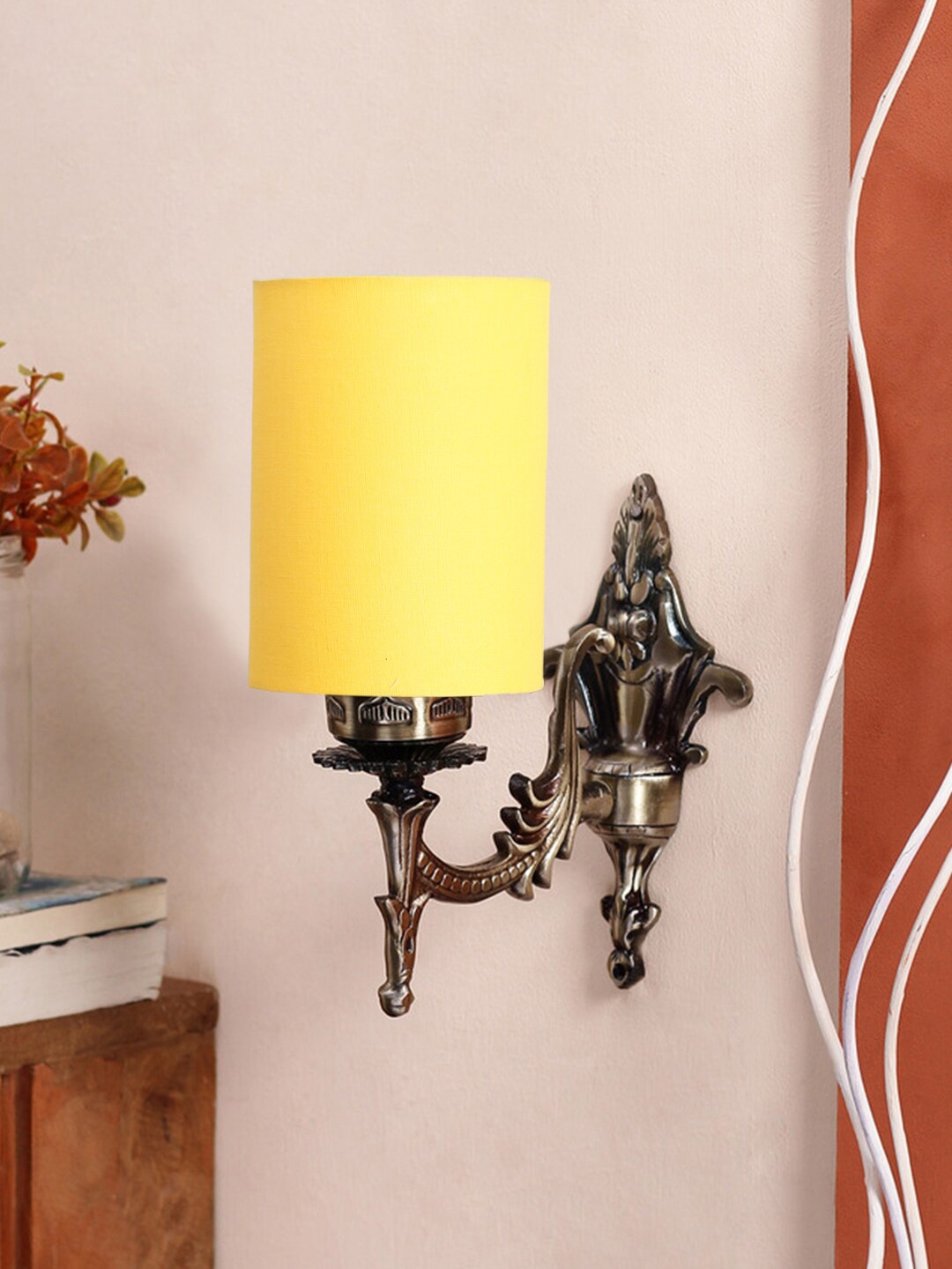 

Devansh Yellow & Gold Toned Antique Wall Lamp With Cotton Conical Shade