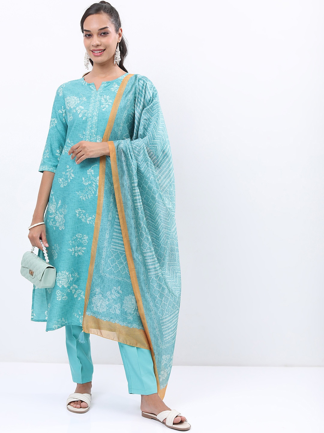 

Vishudh Turquoise Blue & White Floral Printed Kurta With Trousers & Dupatta
