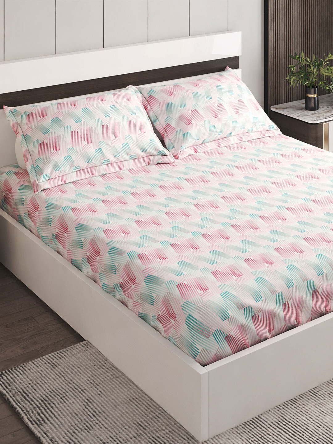 

Home Centre White & Pink Geometric 144 TC Cotton King Bedsheet With 2 Pillow Covers