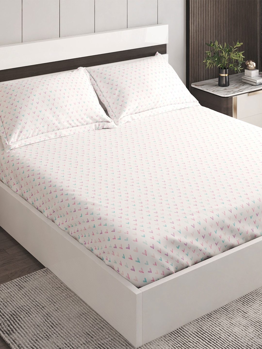 

Home Centre White & Pink Geometric 150 TC Cotton Queen Bedsheet With 2 Pillow Covers