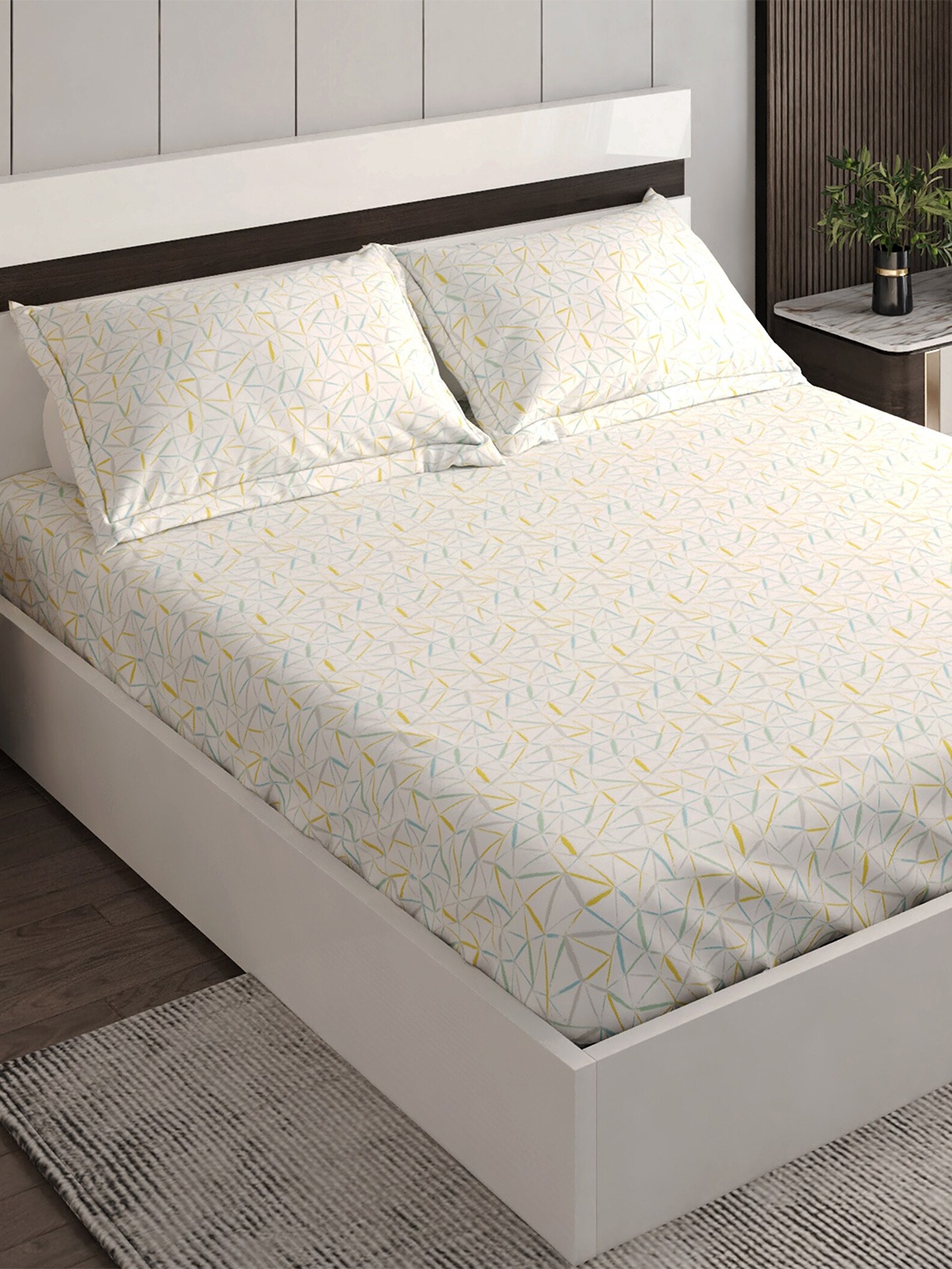 

Home Centre White & Yellow Geometric Cotton 144 TC 3 Pcs King Bedsheet & 2 Pillow Covers