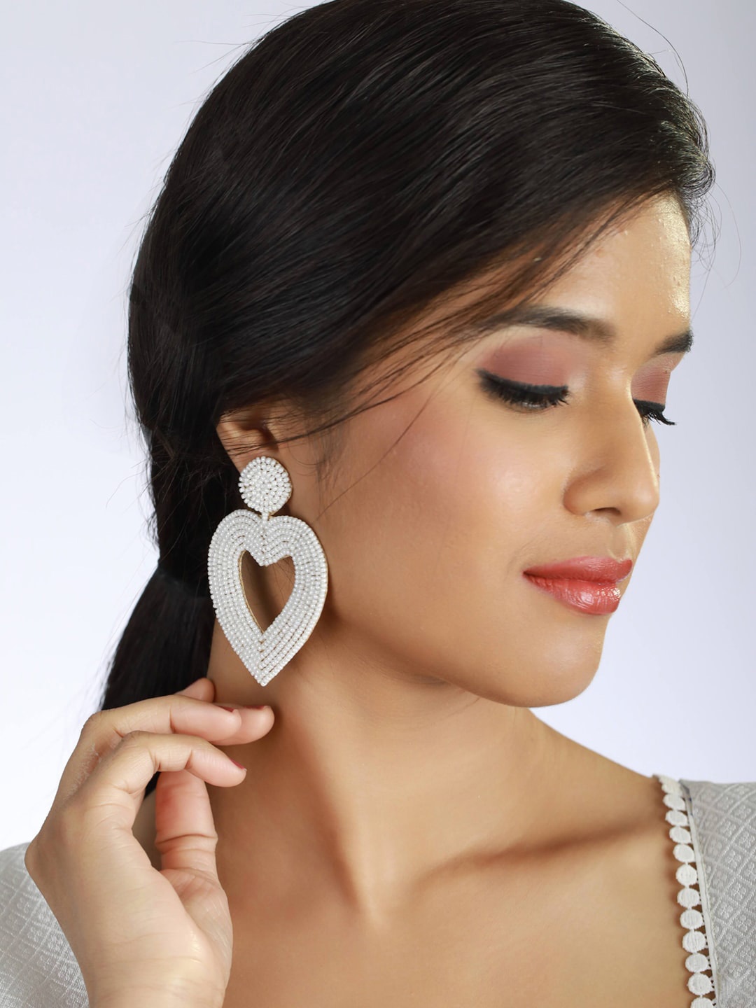 

Sangria White Beaded Heart Shaped Contemporary Drop Earrings