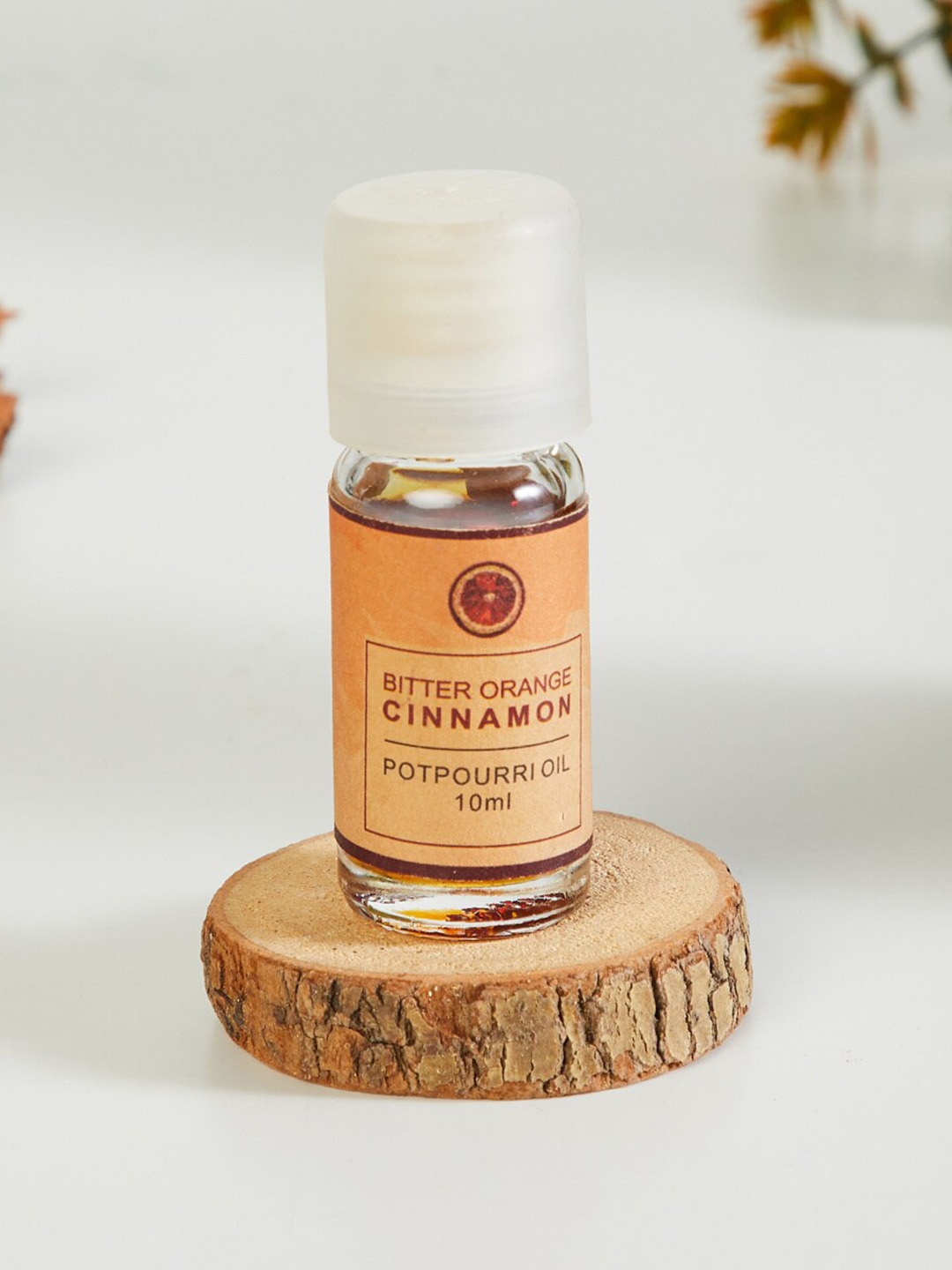 

Home Centre Transparent Corsica Bitter Orange Cinnamon Potpourri Oil - 10ml