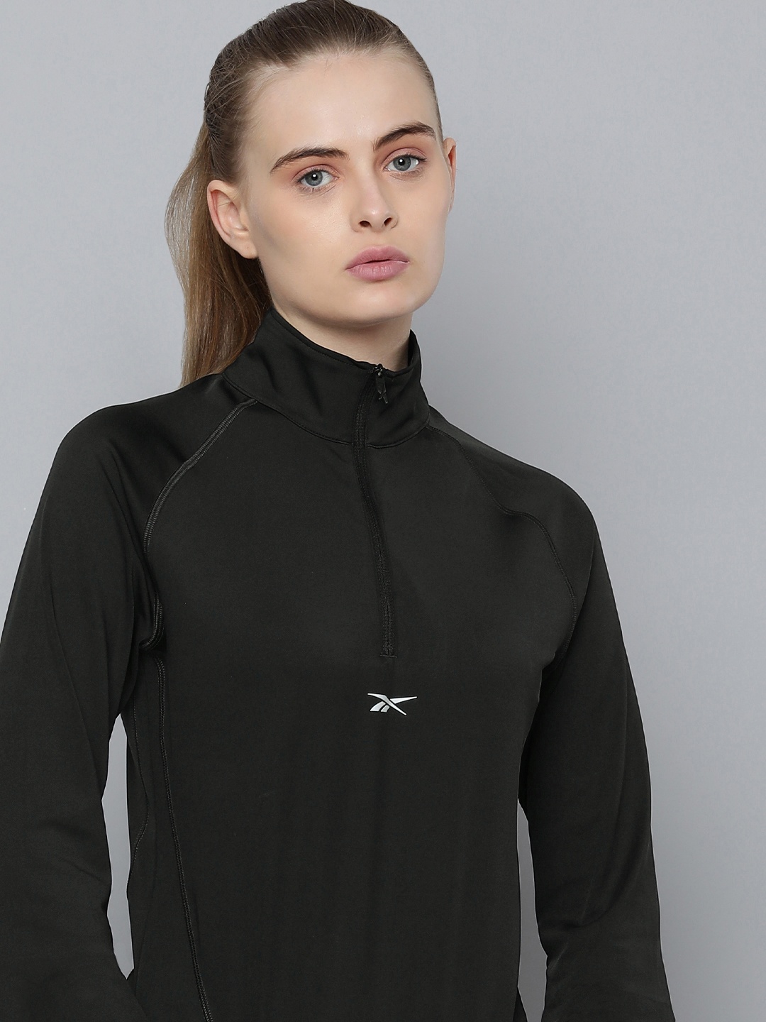 

Reebok Women Solid Sweatshirt, Black